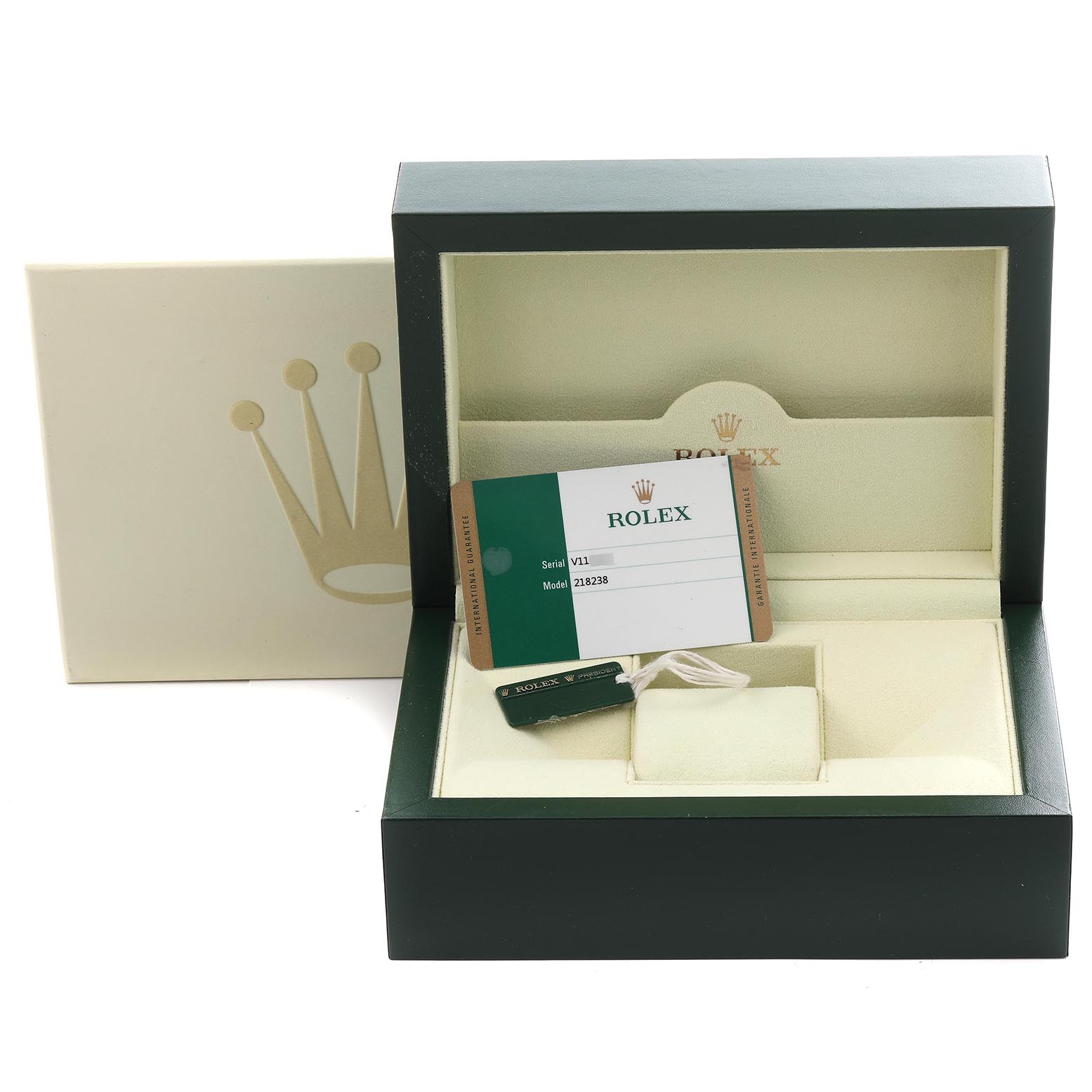 The image shows a Rolex President 218238 Men's Yellow Gold Black Dial 218238 Men's Yellow Gold Black Dial model watch box open, displaying a tag and warranty card inside.