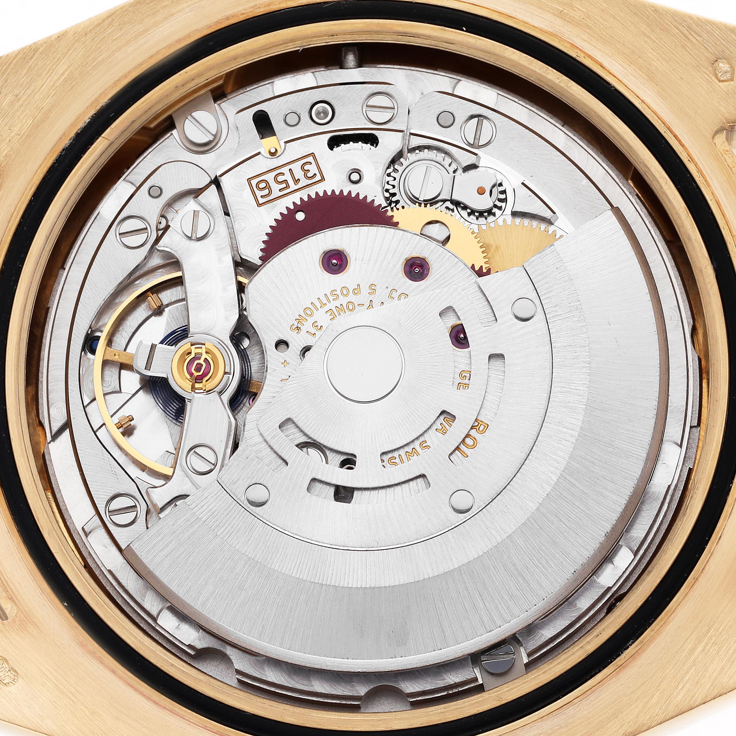 The image shows the intricate movement of a Rolex President 218238 Men's Yellow Gold Black Dial 218238 Men's Yellow Gold Black Dial model from a top-down angle.