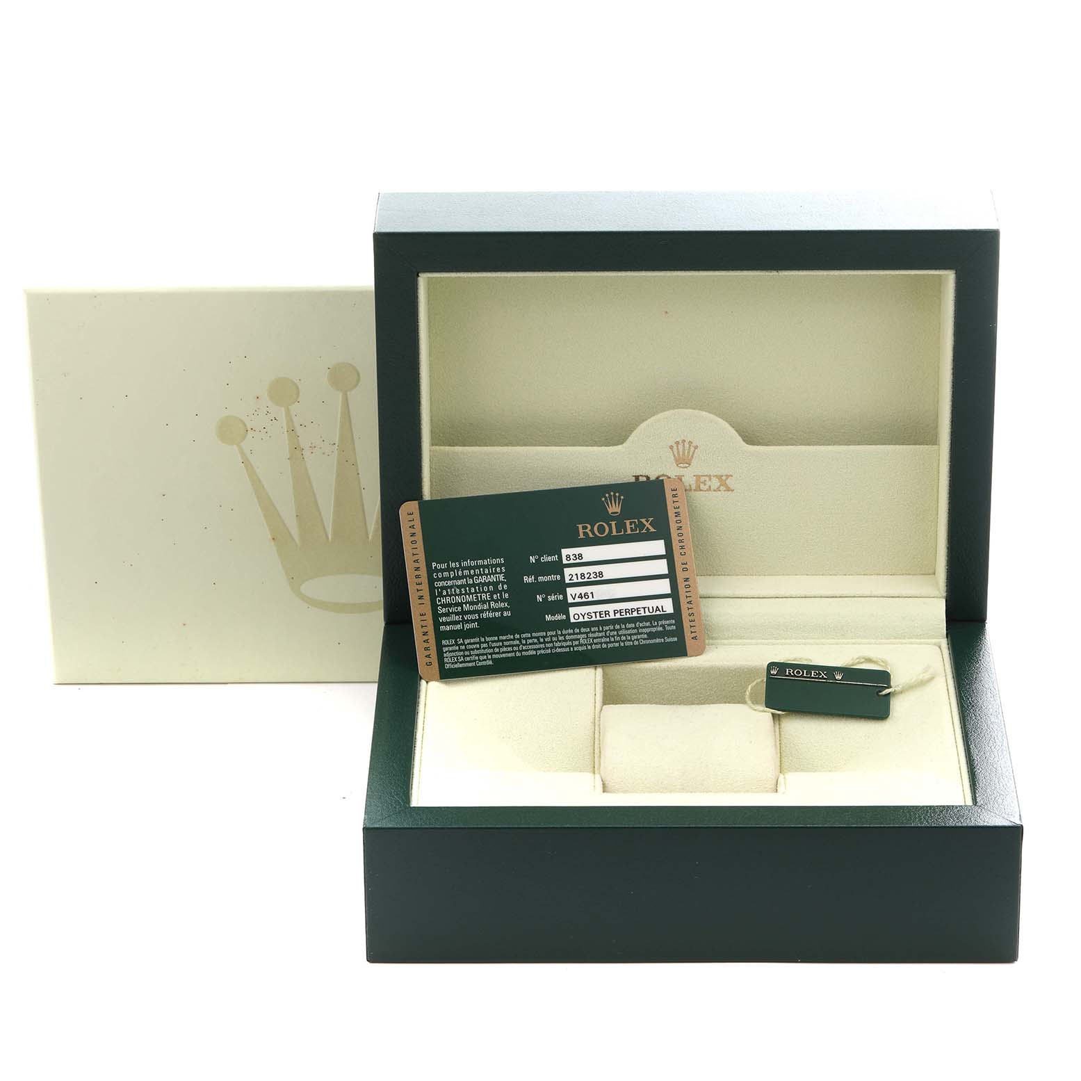 The image shows a Rolex President 218238 Men's Yellow Gold Champagne Dial 218238 Men's Yellow Gold Champagne Dial box with a warranty card and tag inside, viewed from the front.