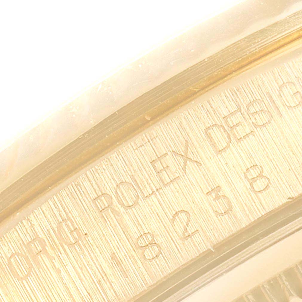 This image shows a close-up of the Rolex serial number engraving on the bezel of a President model watch.