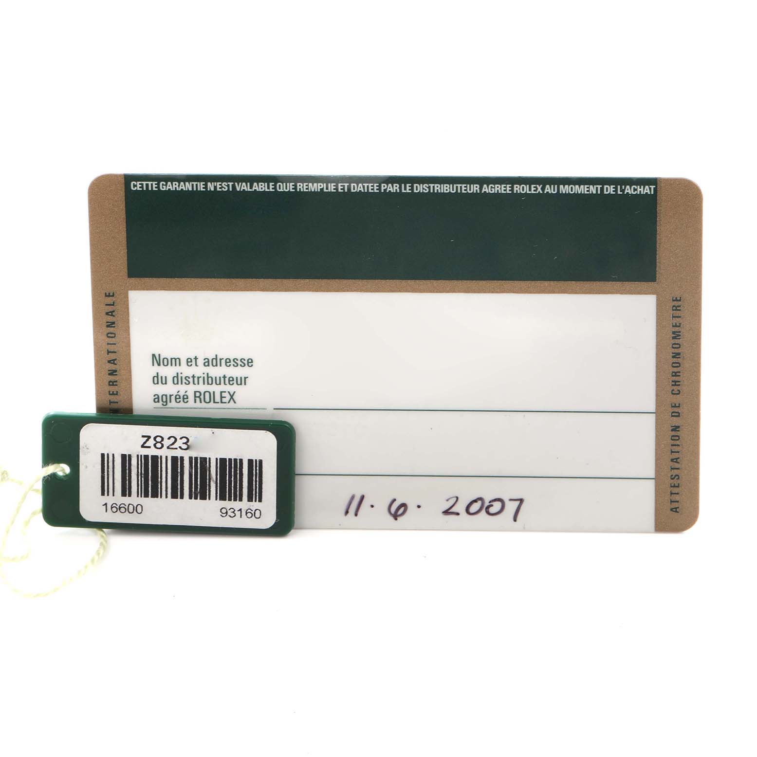 The image shows a guarantee card and tag for a Rolex Sea-Dweller 16600 Men's Stainless Steel Black Dial 16600 Men's Stainless Steel Black Dial watch, displaying certification details.