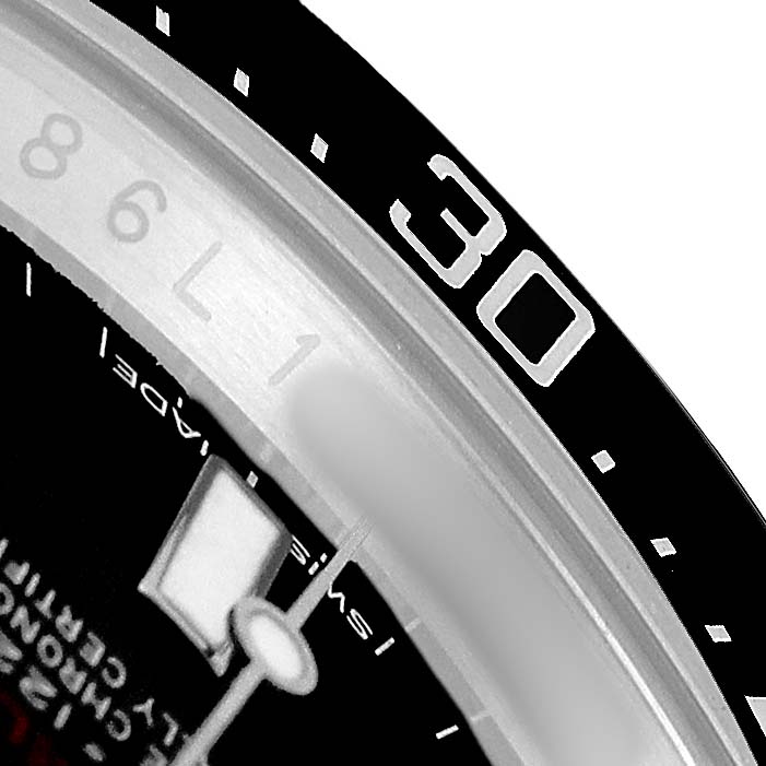 The image shows a close-up of the bezel and dial of the Rolex Sea-Dweller 126600 Men's Stainless Steel Black Dial, highlighting the 30-minute marker.