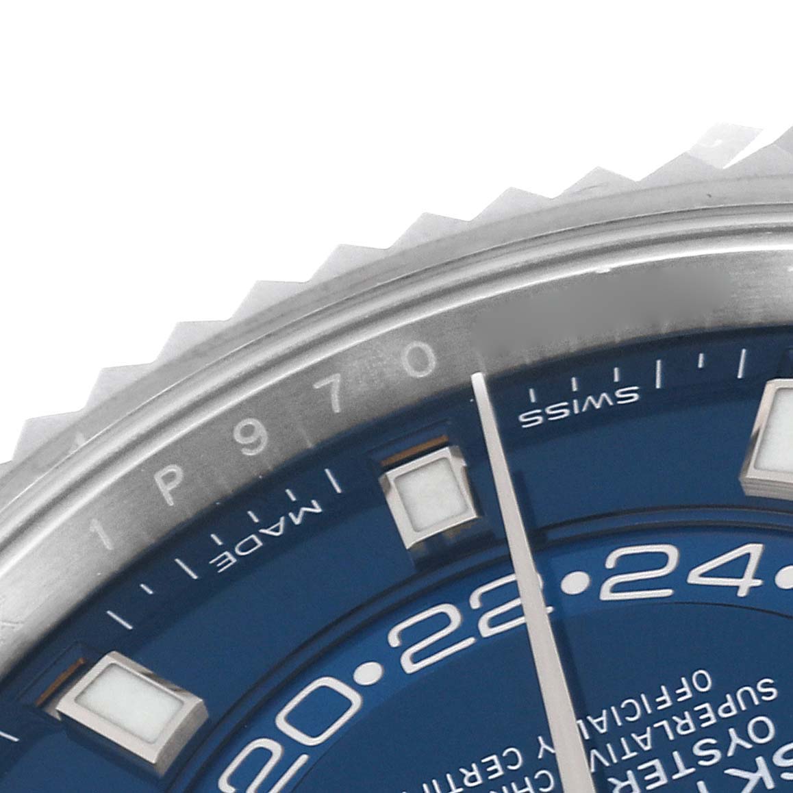 Close-up of the Rolex Sky-Dweller 326934 Men's Stainless Steel Blue Dial 326934 Men's Stainless Steel Blue Dial watch, showing part of the bezel, blue dial, and hour markers.