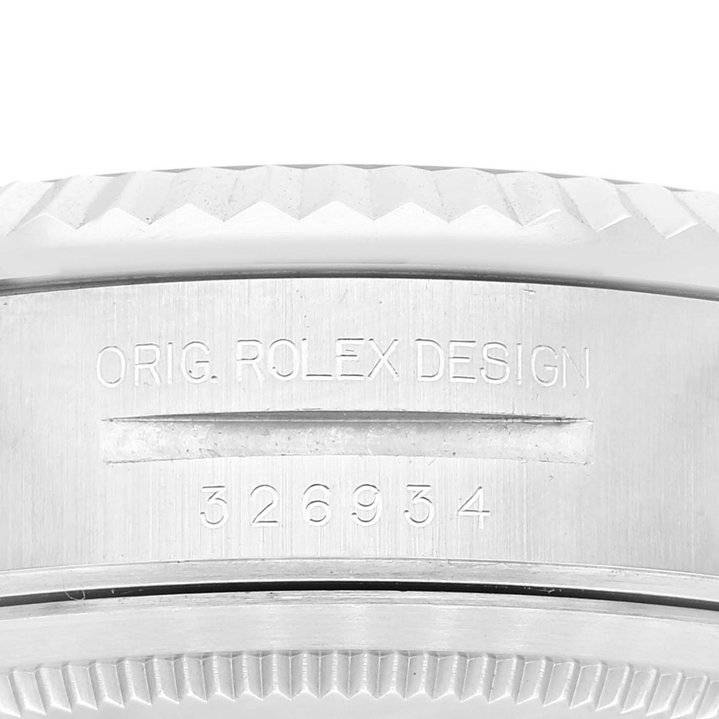 The image shows the side view of the case of the Rolex Sky-Dweller 326934 Men's Stainless Steel Blue Dial 326934 Men's Stainless Steel Blue Dial, featuring engravings "ORIG. ROLEX DESIGN" and the model number "326934."