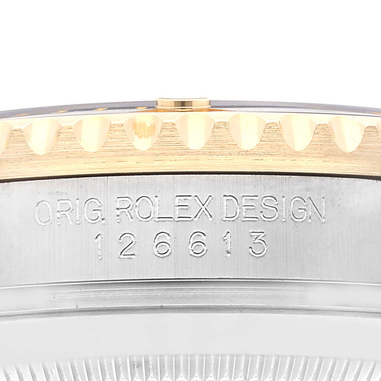 This image shows a close-up of the side of a Rolex Sea-Dweller 126613 Men
s Steel and Gold (two tone) Black Dial 126613 Men
s Steel and Gold (two tone) Black Dial watch casing with the model number 126613 engraved.