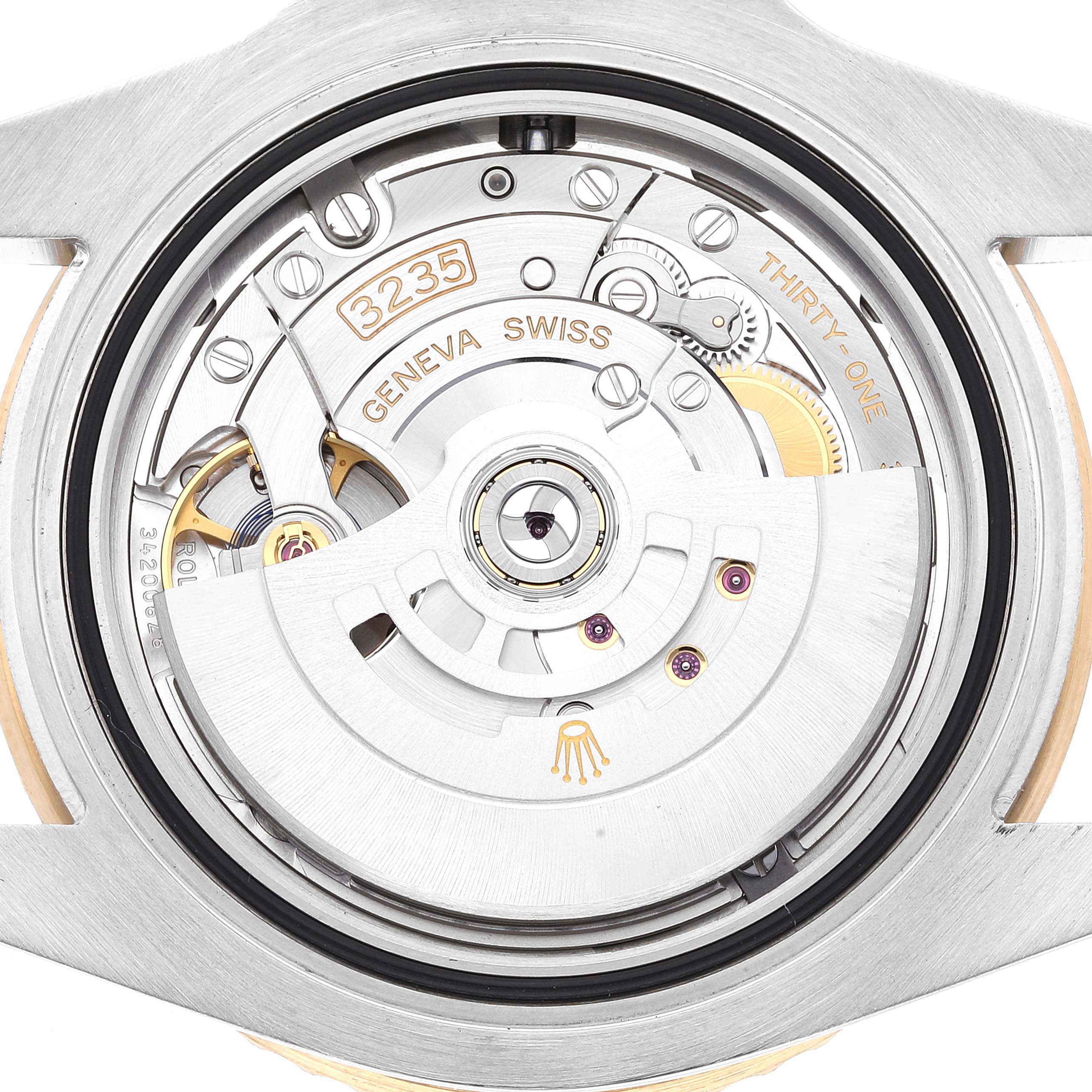 This image shows the rear view of a Rolex Sea-Dweller 126613 Men
s Steel and Gold (two tone) Black Dial 126613 Men
s Steel and Gold (two tone) Black Dial watch, highlighting its intricate movement and internal components.