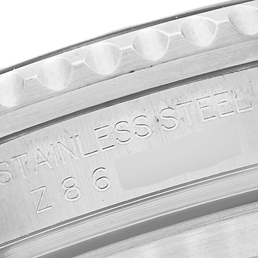 This image shows a close-up, angled view of the bezel and the engraved side of the stainless steel case of a Rolex Submariner 16610 Men
s Stainless Steel Black Dial 16610 Men
s Stainless Steel Black Dial watch.