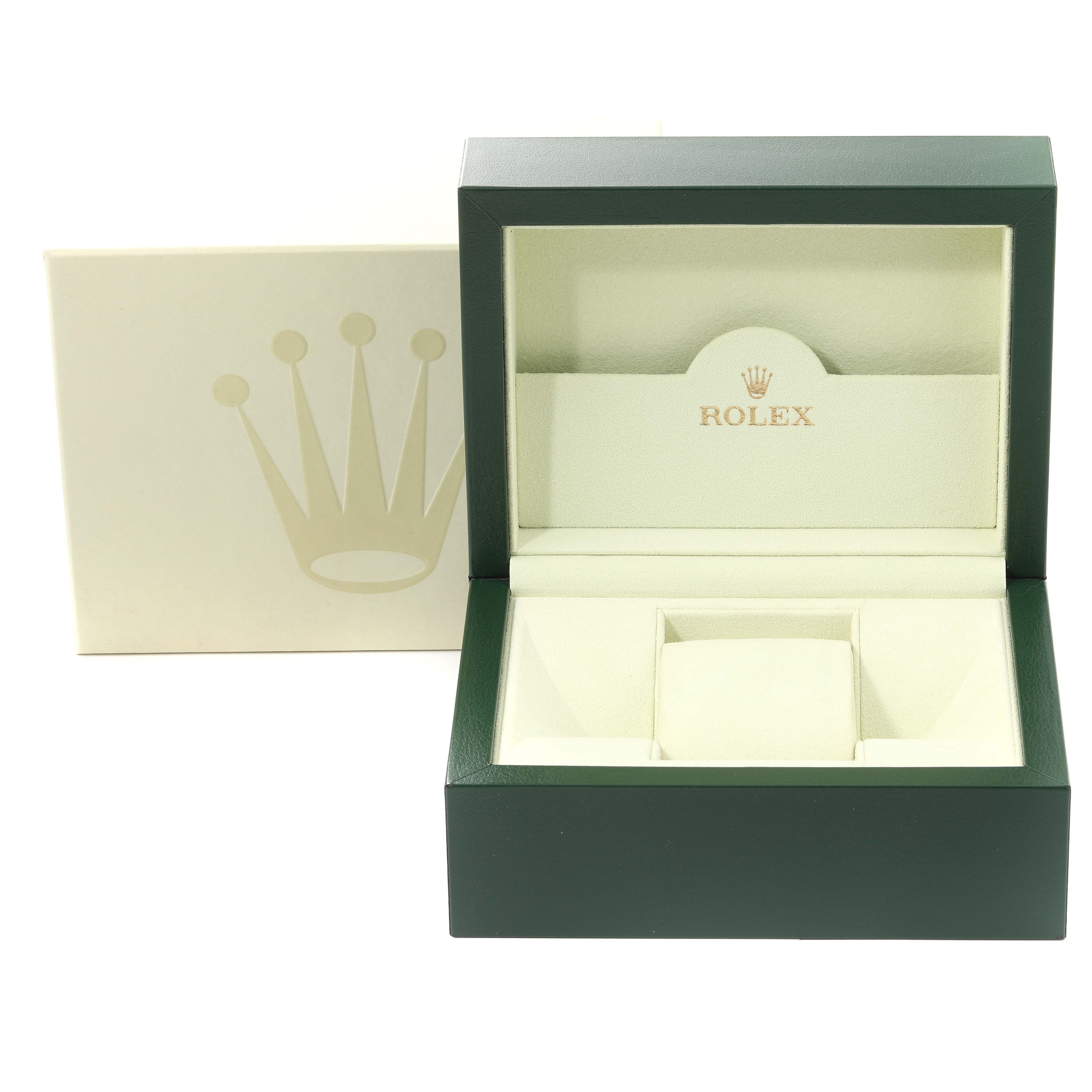 The image shows an open Rolex watch box for the Submariner model, including an outer box with the logo.