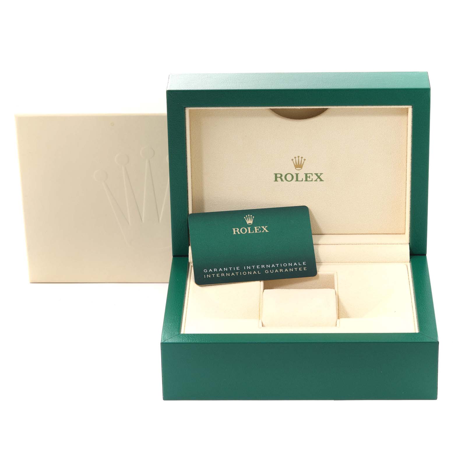 The image shows an open green and beige Rolex box and warranty card for the Submariner model, viewed from the front.