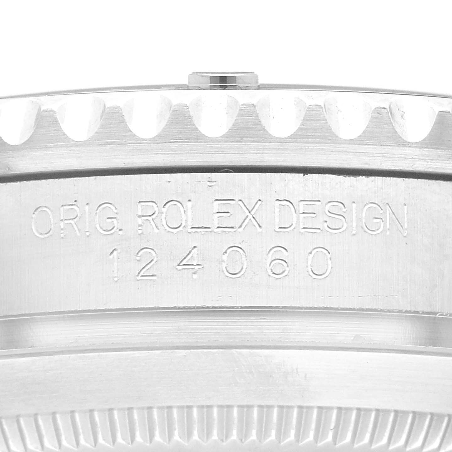 The image shows an up-close view of the side of the Rolex Submariner 124060 Men
s Stainless Steel Black Dial 124060 Men
s Stainless Steel Black Dial watch, highlighting the engraved text and model number 124060.