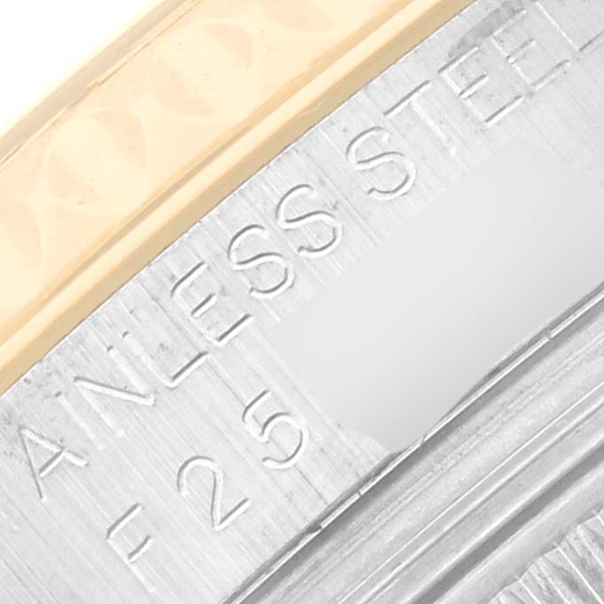 This close-up image shows the side engraving on the case of a Rolex Yacht-Master 168623 Men's Steel and Gold (two tone) Grey Dial 168623 Men's Steel and Gold (two tone) Grey Dial watch, indicating it is made of stainless steel.