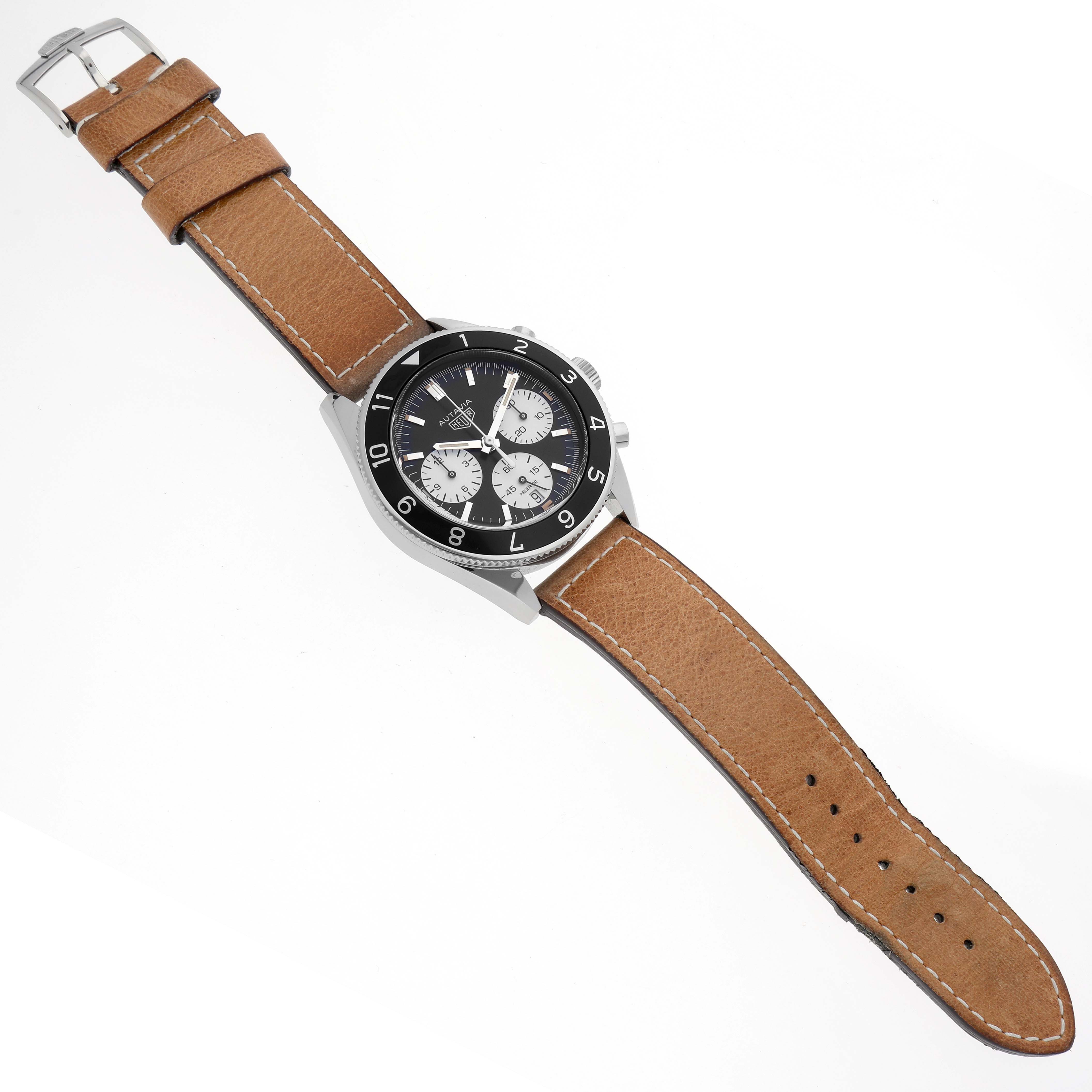 The Tag Heuer Autavia CBE2110 Men's Stainless Steel Black Dial CBE2110 Men's Stainless Steel Black Dial watch is shown at an angled view, highlighting the face, bezel, case, and leather strap.