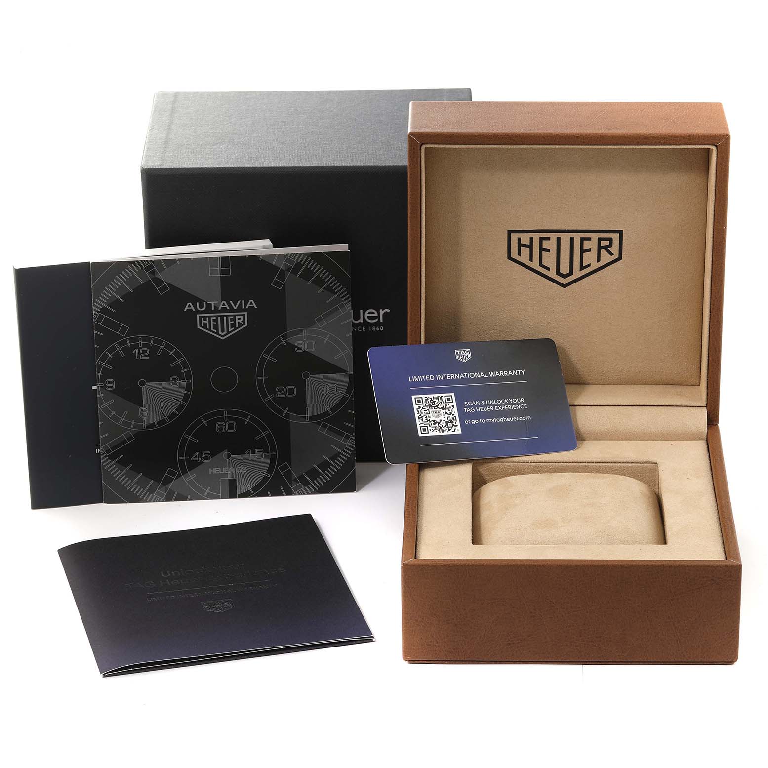 The image shows the packaging, warranty card, and user manual for a Tag Heuer Autavia CBE2110 Men's Stainless Steel Black Dial CBE2110 Men's Stainless Steel Black Dial model, with the watch box open.