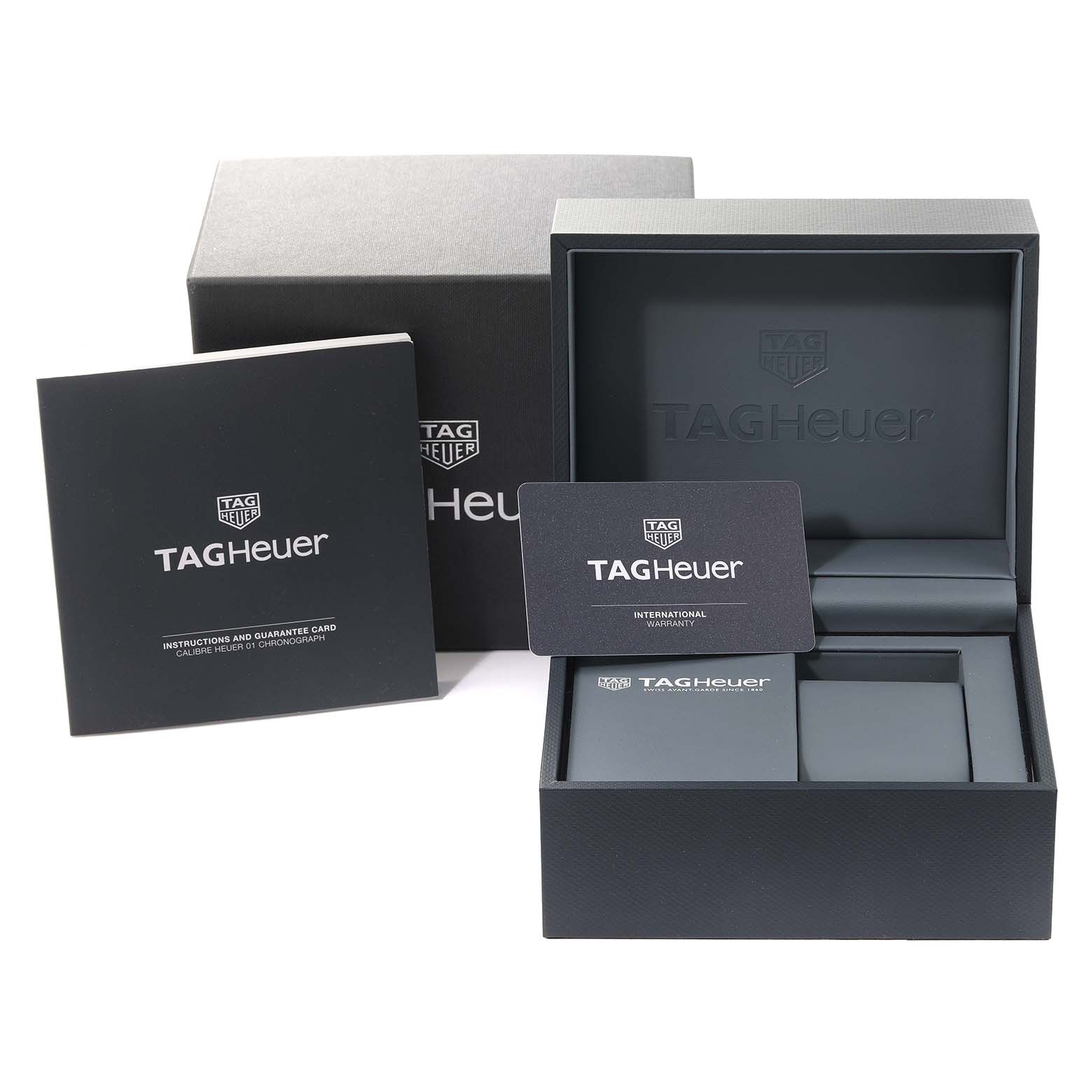 The image shows the packaging, warranty card, and instruction manual for a Tag Heuer Carrera CAR201T Men's Stainless Steel Blue Dial CAR201T Men's Stainless Steel Blue Dial watch.