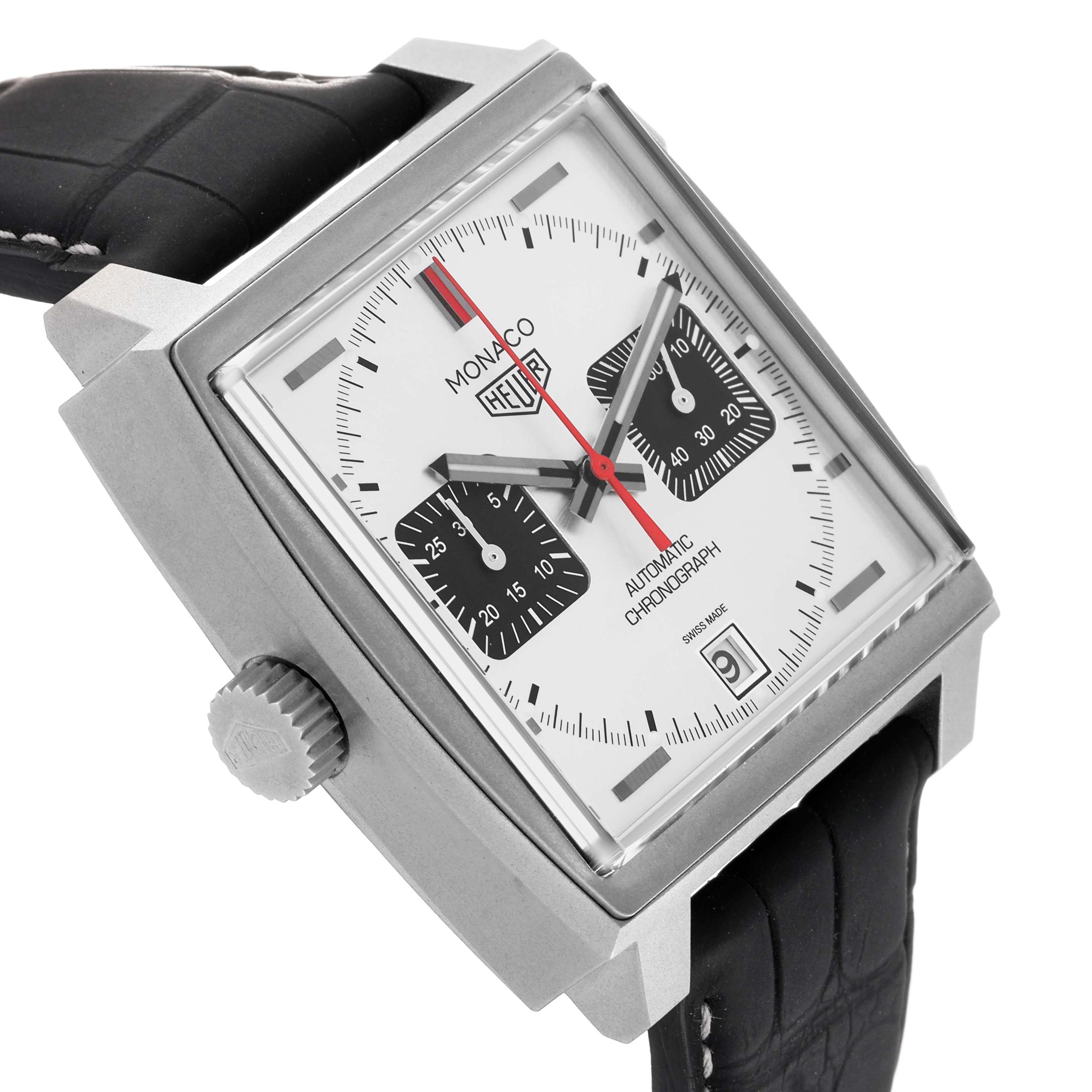 The Tag Heuer Monaco CAW218B.FC6496 Men's Titanium Silver Dial watch is shown from an angled side view, displaying the square face, crown, and black leather strap.