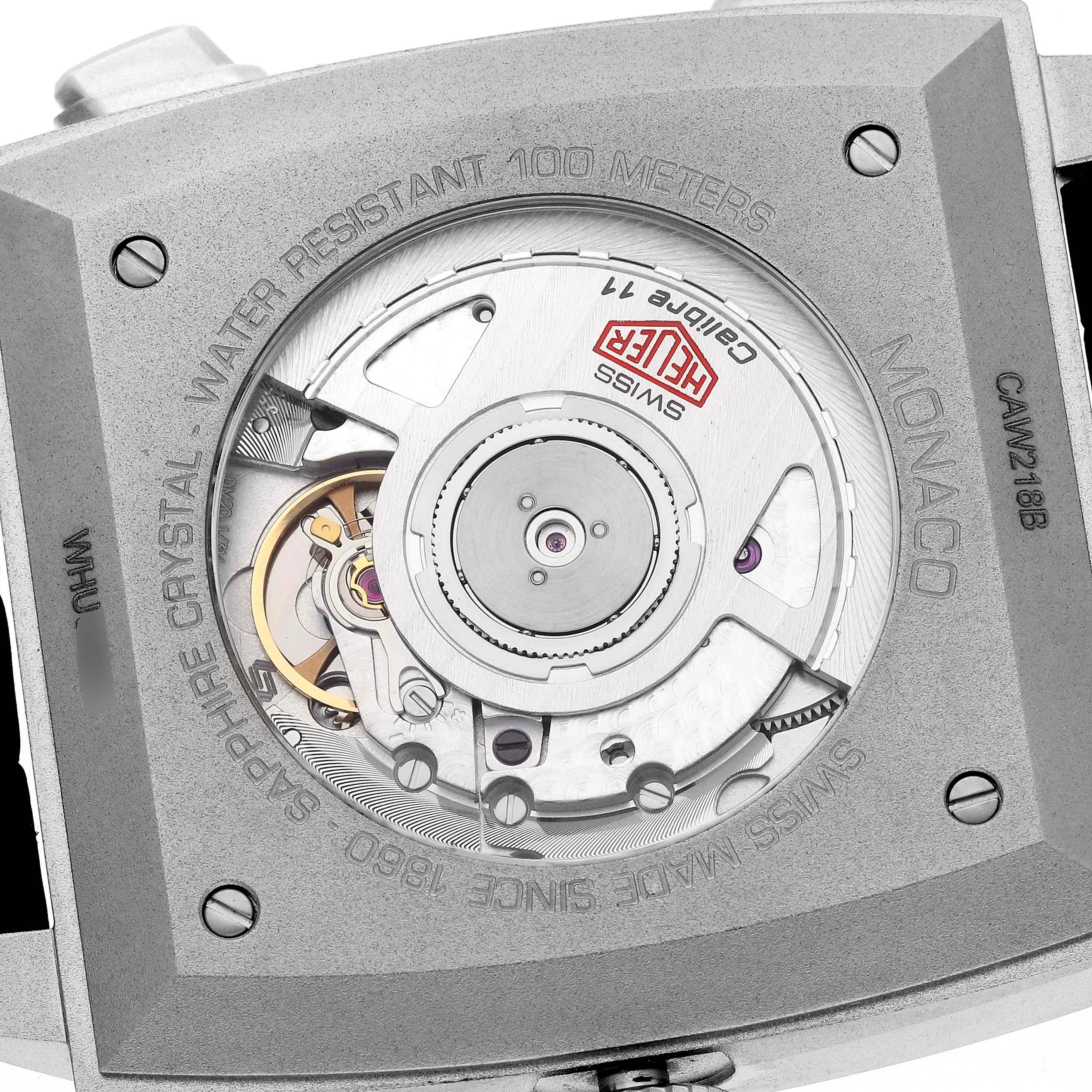 This image shows the back view of a Tag Heuer Monaco CAW218B.FC6496 Men
s Titanium Silver Dial CAW218B.FC6496 Men
s Titanium Silver Dial watch, highlighting its movement and engravings.