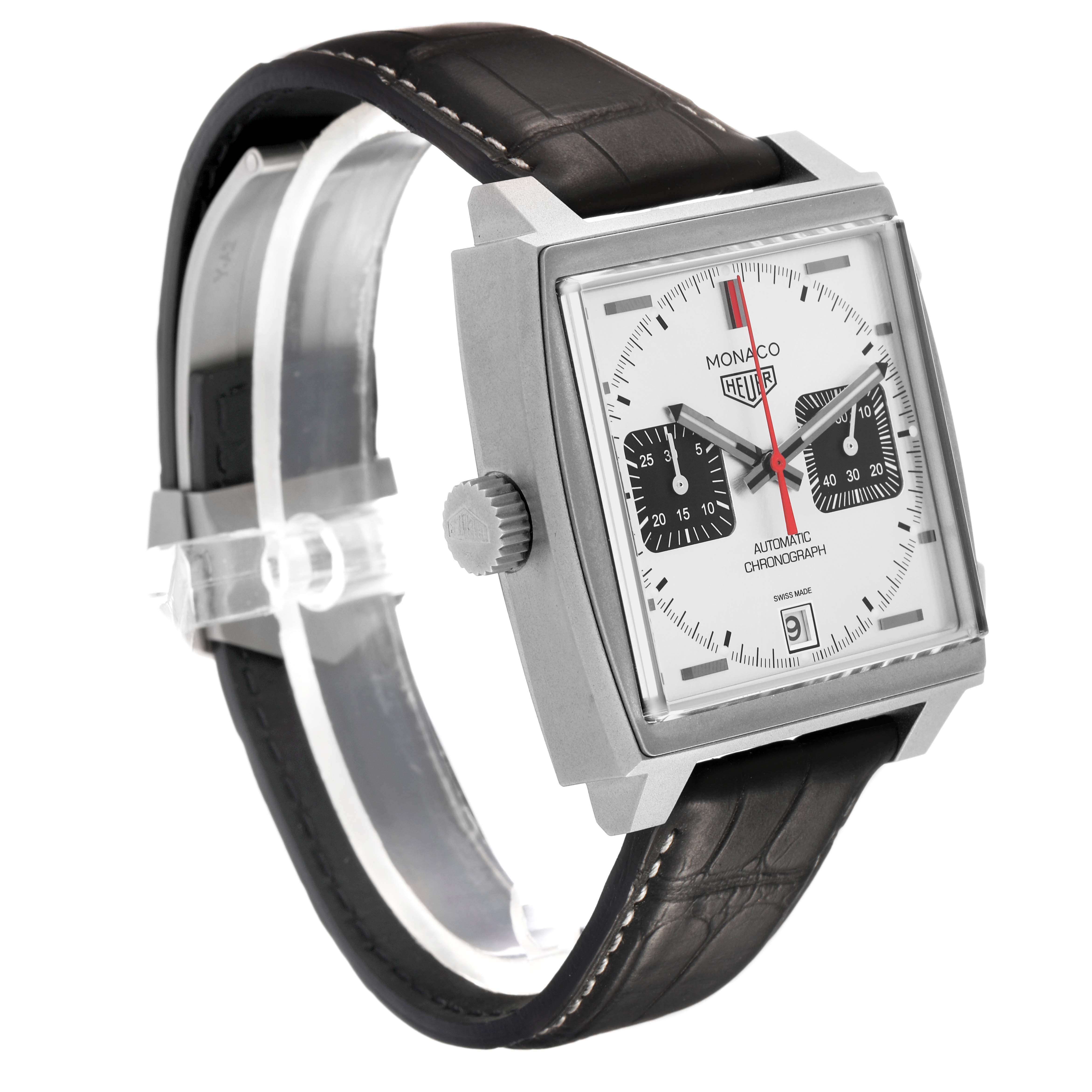 The Tag Heuer Monaco CAW218B.FC6496 Men's Titanium Silver Dial watch is shown from a three-quarter angle, highlighting the face, crown, and leather strap.