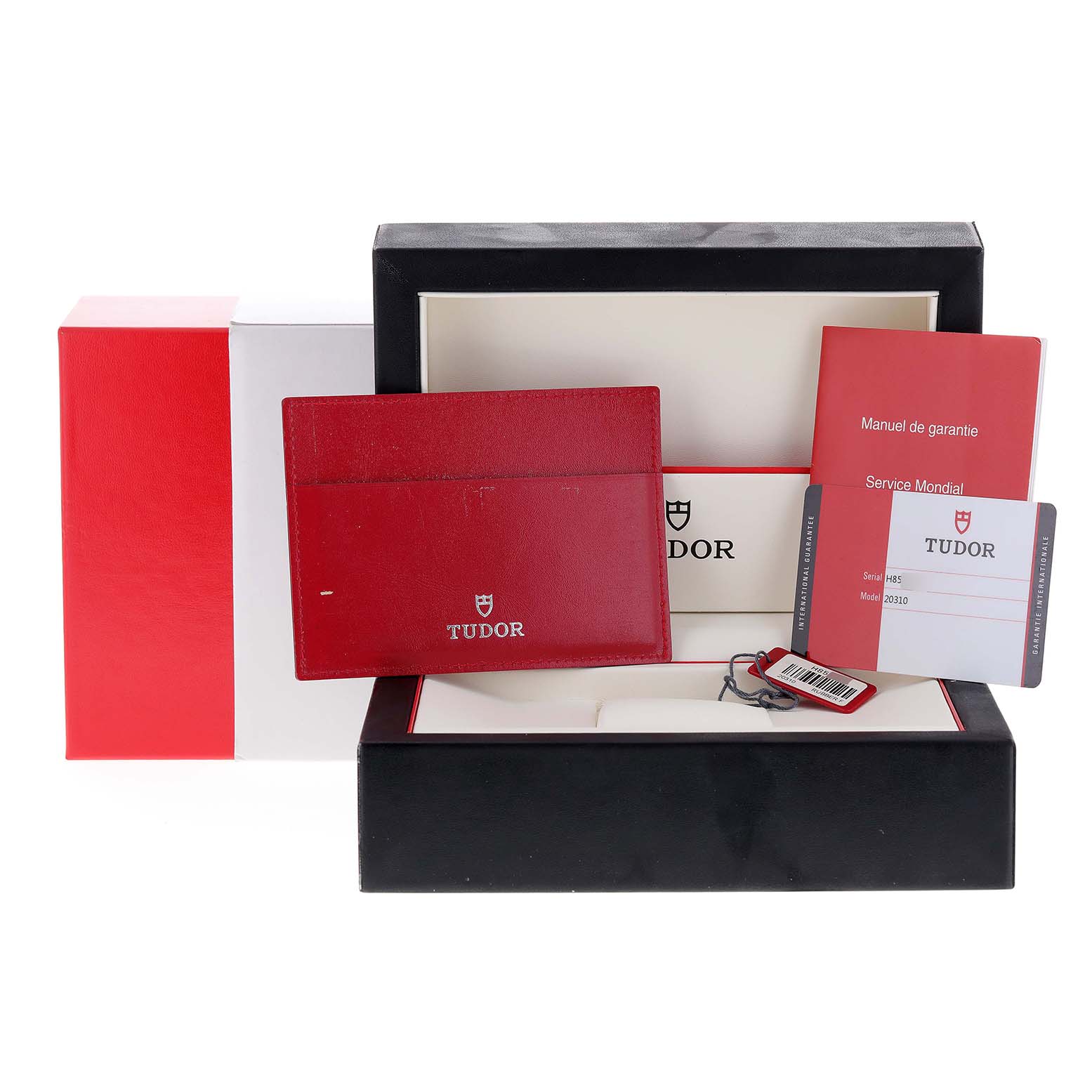 The image shows the packaging and accessories for the Tudor 20310 Women
s Stainless Steel White Dial 20310 Women
s Stainless Steel White Dial Grantour Fuchsia Strap Steel Diamond Unisex Watch model 20310.