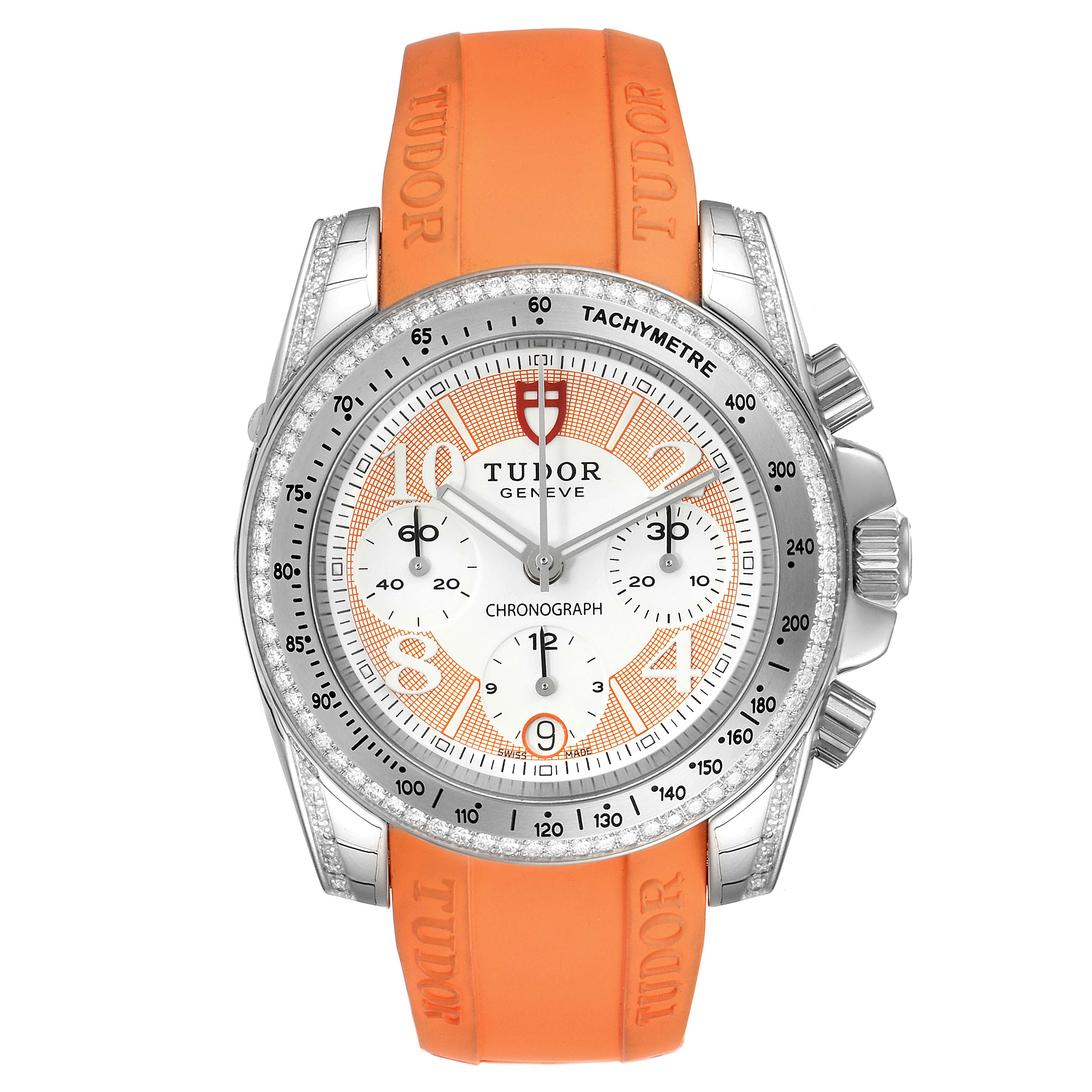 The image shows a front view of the Tudor Grantour 20310 Men's Stainless Steel White Dial 20310 Men's Stainless Steel White Dial watch with an orange strap, showcasing its dial, bezel, and chronograph sub-dials.