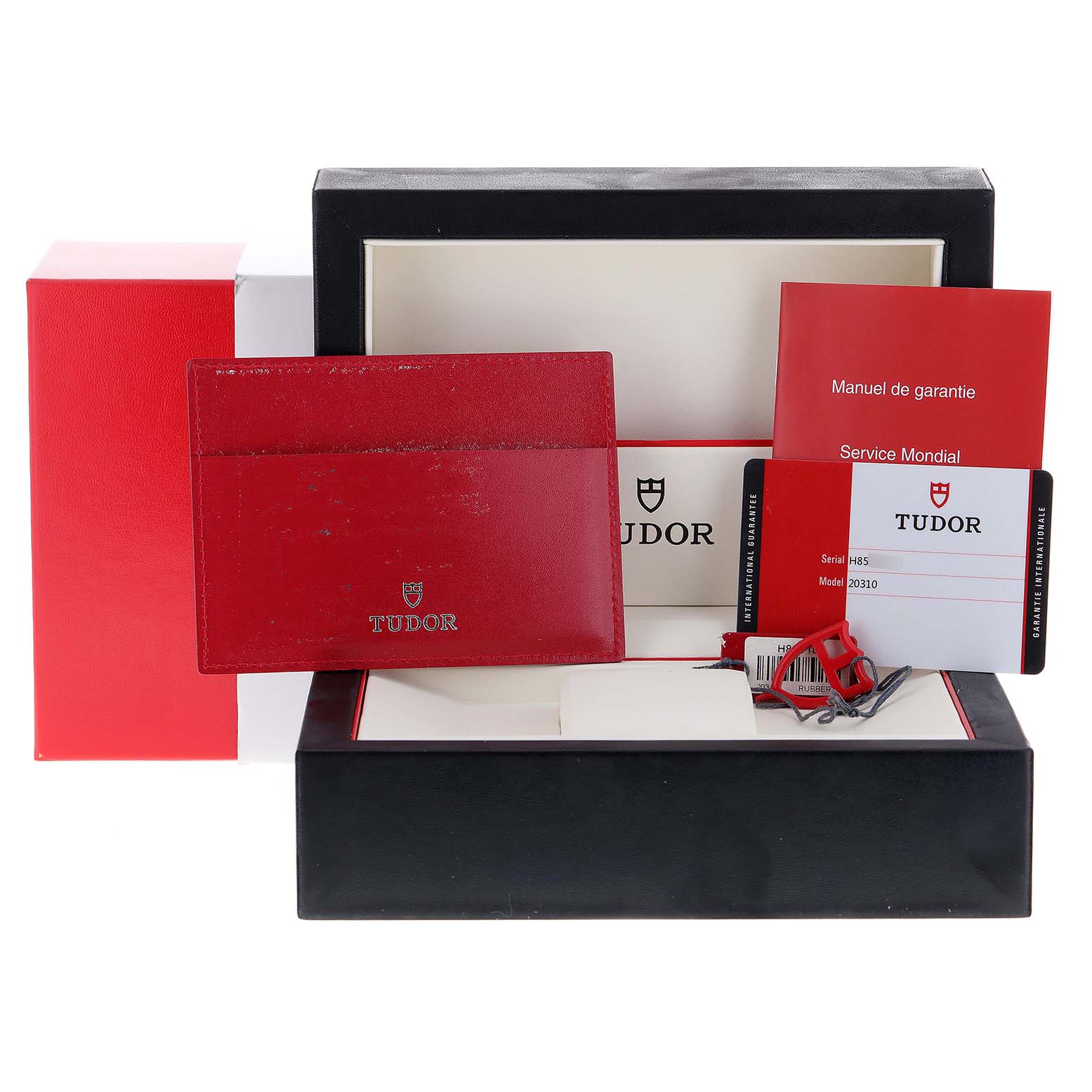 The image shows the Tudor Grantour 20310 Men's Stainless Steel White Dial 20310 Men's Stainless Steel White Dial model packaging, including the box, manuals, warranty card, and tags.