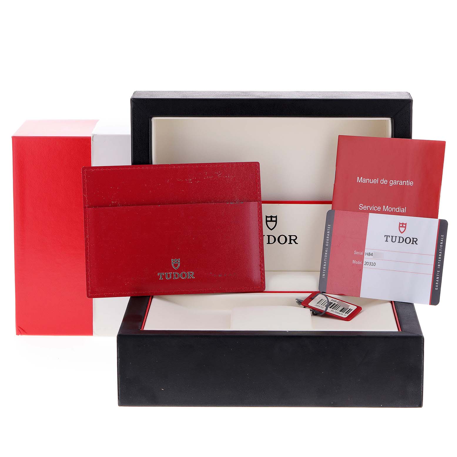 The image shows the box, warranty cards, and accessories for the Tudor Grantour 20310 Men's Stainless Steel White Dial 20310 Men's Stainless Steel White Dial watch.