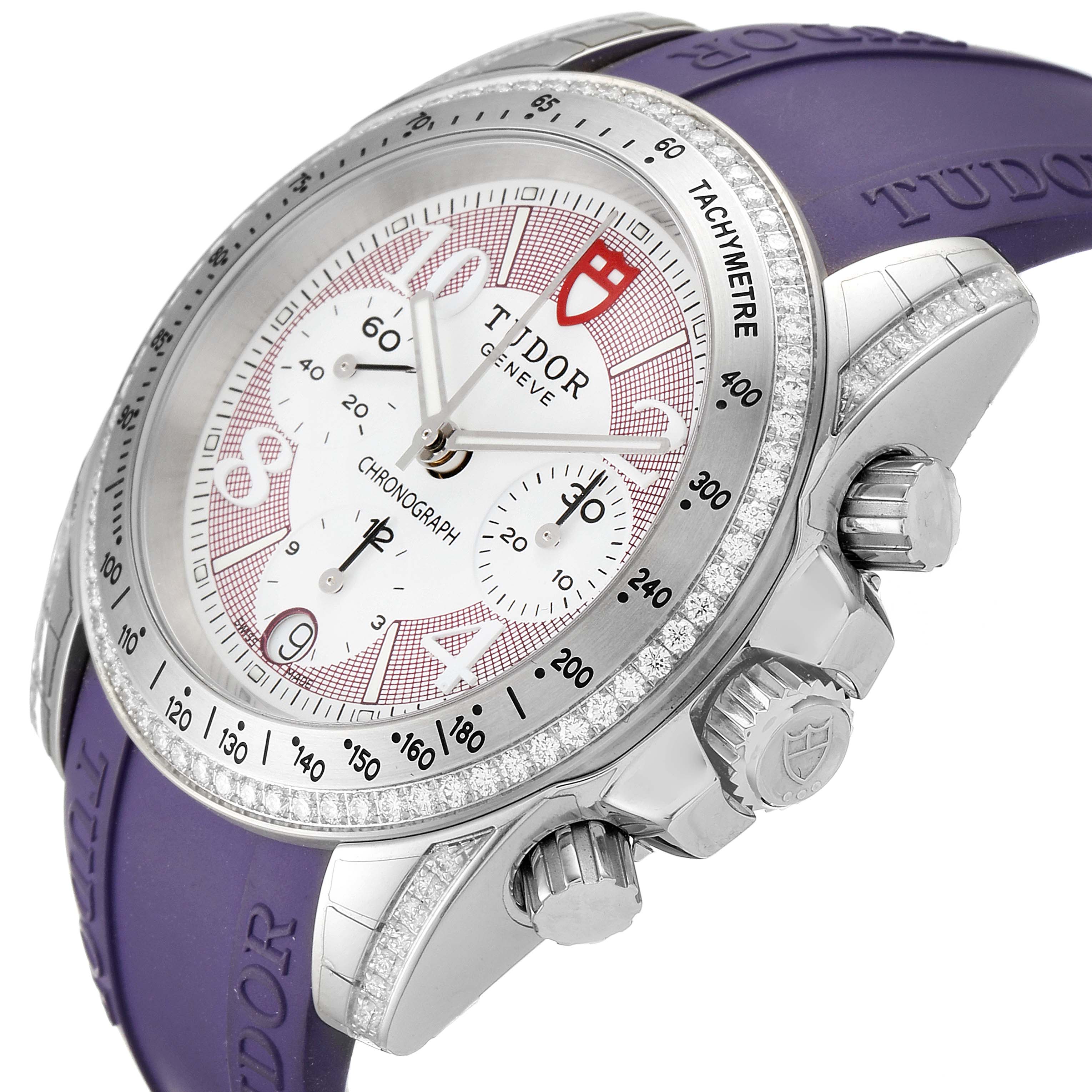 The Tudor Grantour 20310 Men's Stainless Steel White Dial 20310 Men's Stainless Steel White Dial watch is shown at an angled side view, highlighting the dial, bezel, crown, and pushers, with a purple strap.