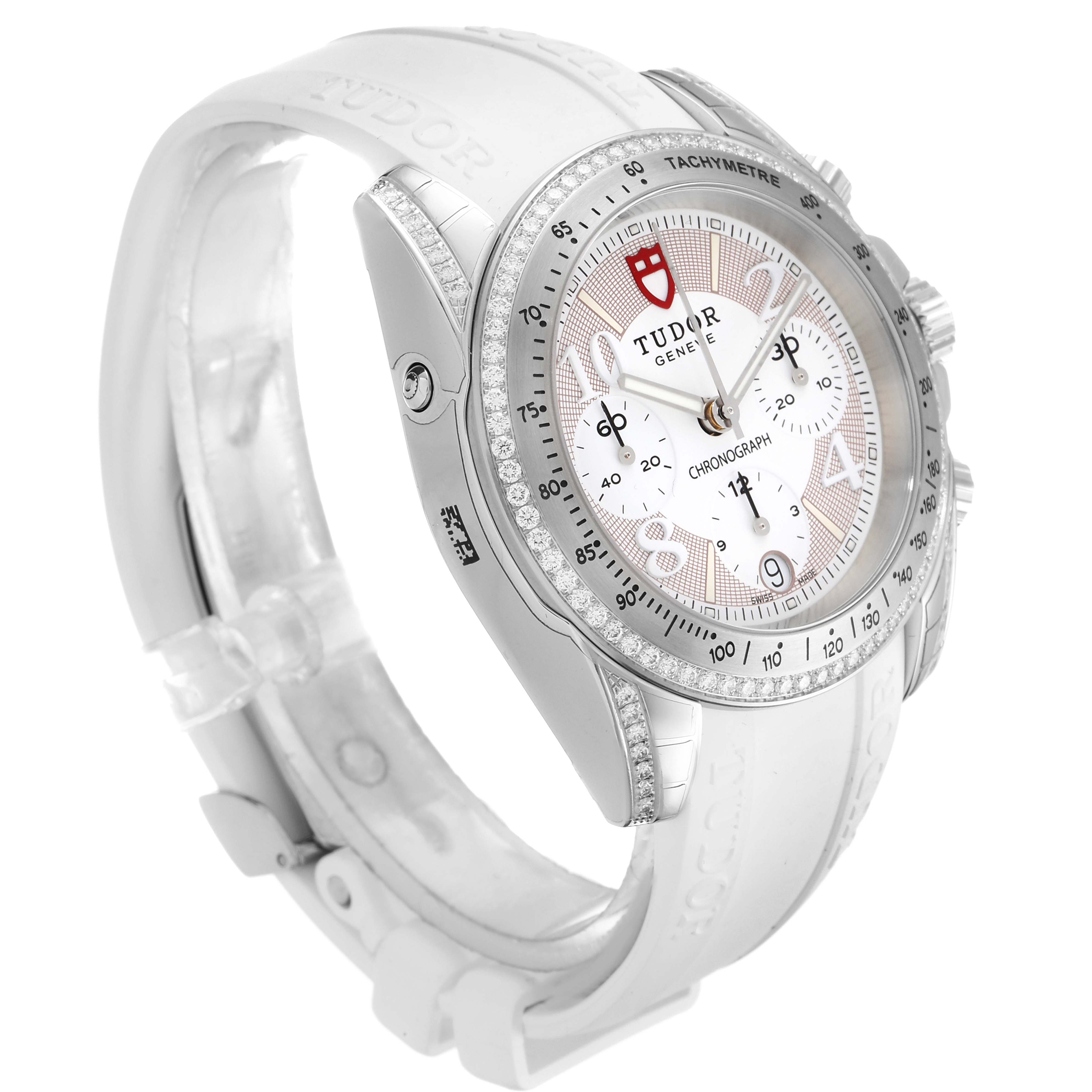 The Tudor Grantour 20310 Men's Stainless Steel White Dial 20310 Men's Stainless Steel White Dial model watch is shown at an angled view, highlighting its face, bezel, and partially visible white strap.