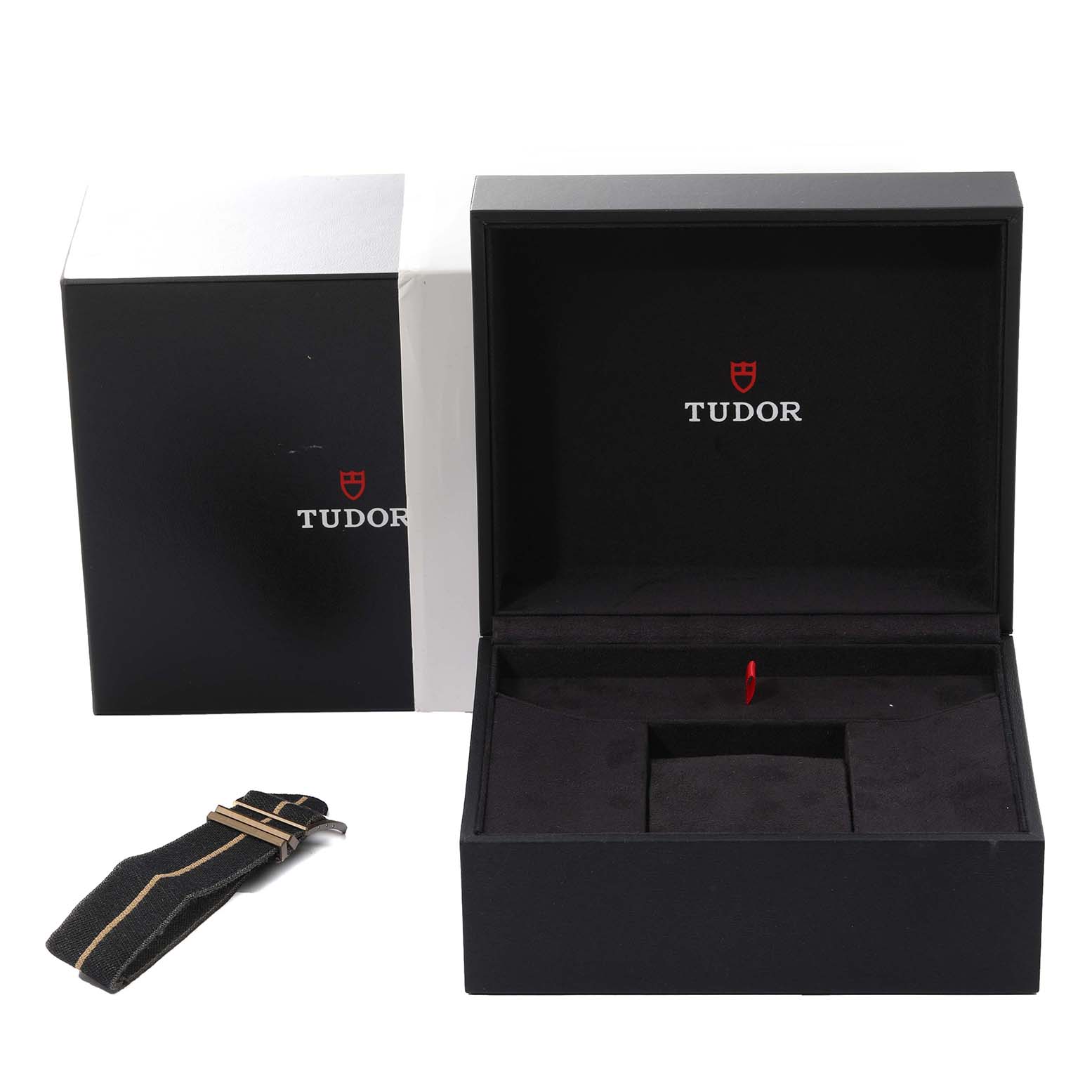 The image shows a Tudor Heritage Black Bay 79250B Men's Bronze Grey Dial 79250B Men's Bronze Grey Dial watch box and an extra strap, displayed from a frontal angle.