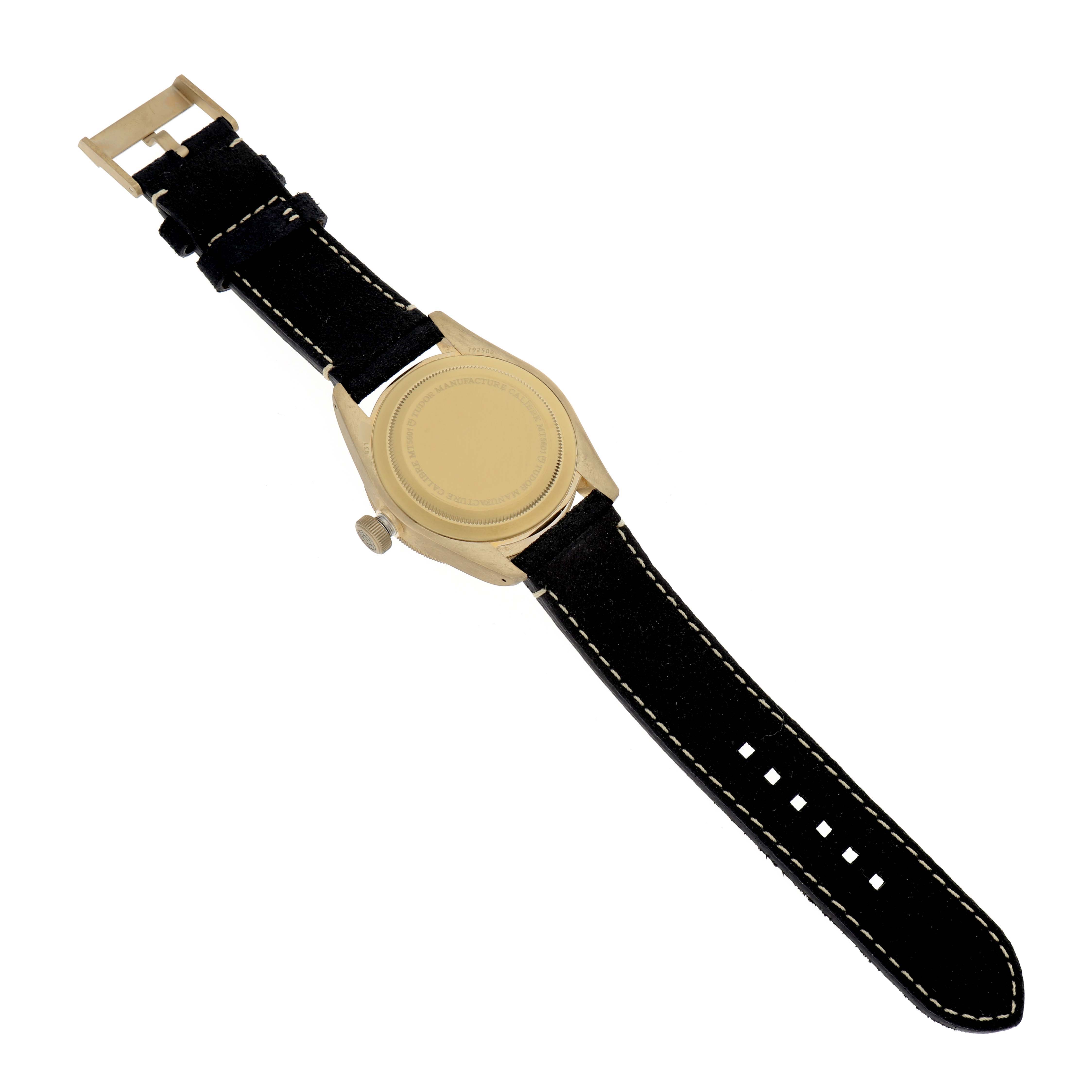 The image shows the back view of a Heritage Black Bay by Tudor with its strap and buckle visible.