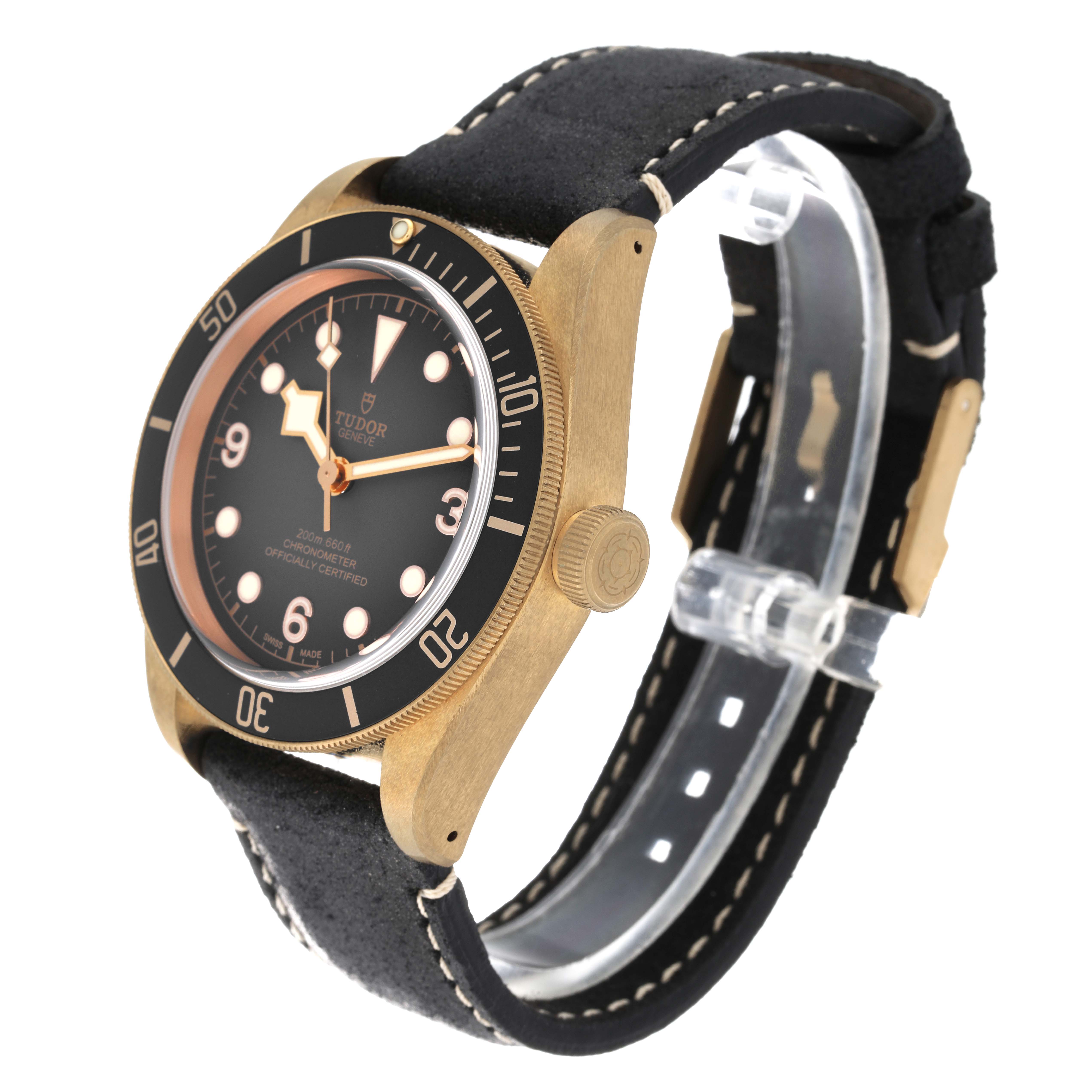 The Tudor Heritage Black Bay 79250B Men's Bronze Grey Dial 79250B Men's Bronze Grey Dial watch is shown at a three-quarter angle, highlighting its face, bezel, crown, and strap.