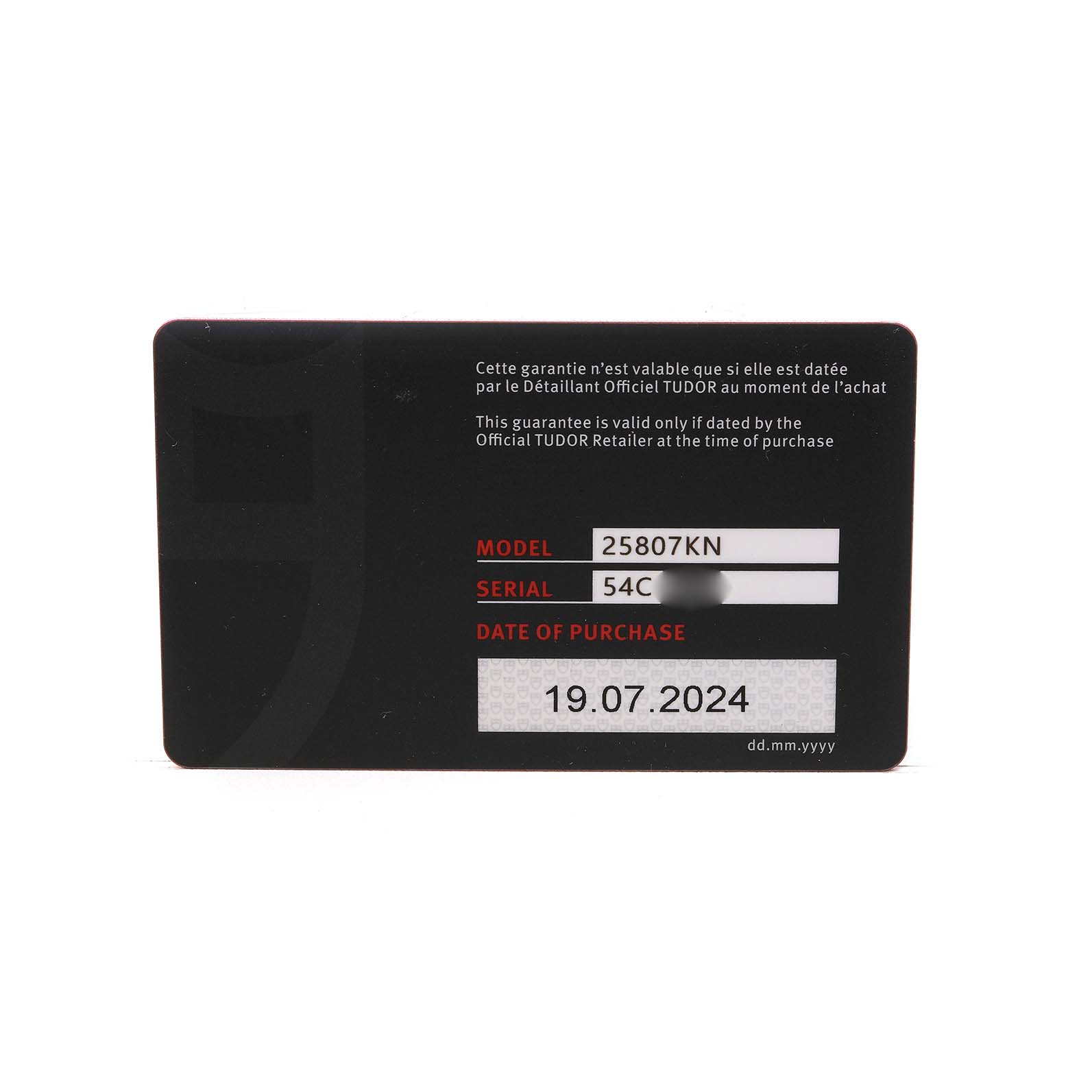 The image shows a warranty card for a Tudor Pelagos M25807KN Men's Ceramic Blue Dial watch, featuring model and serial numbers.