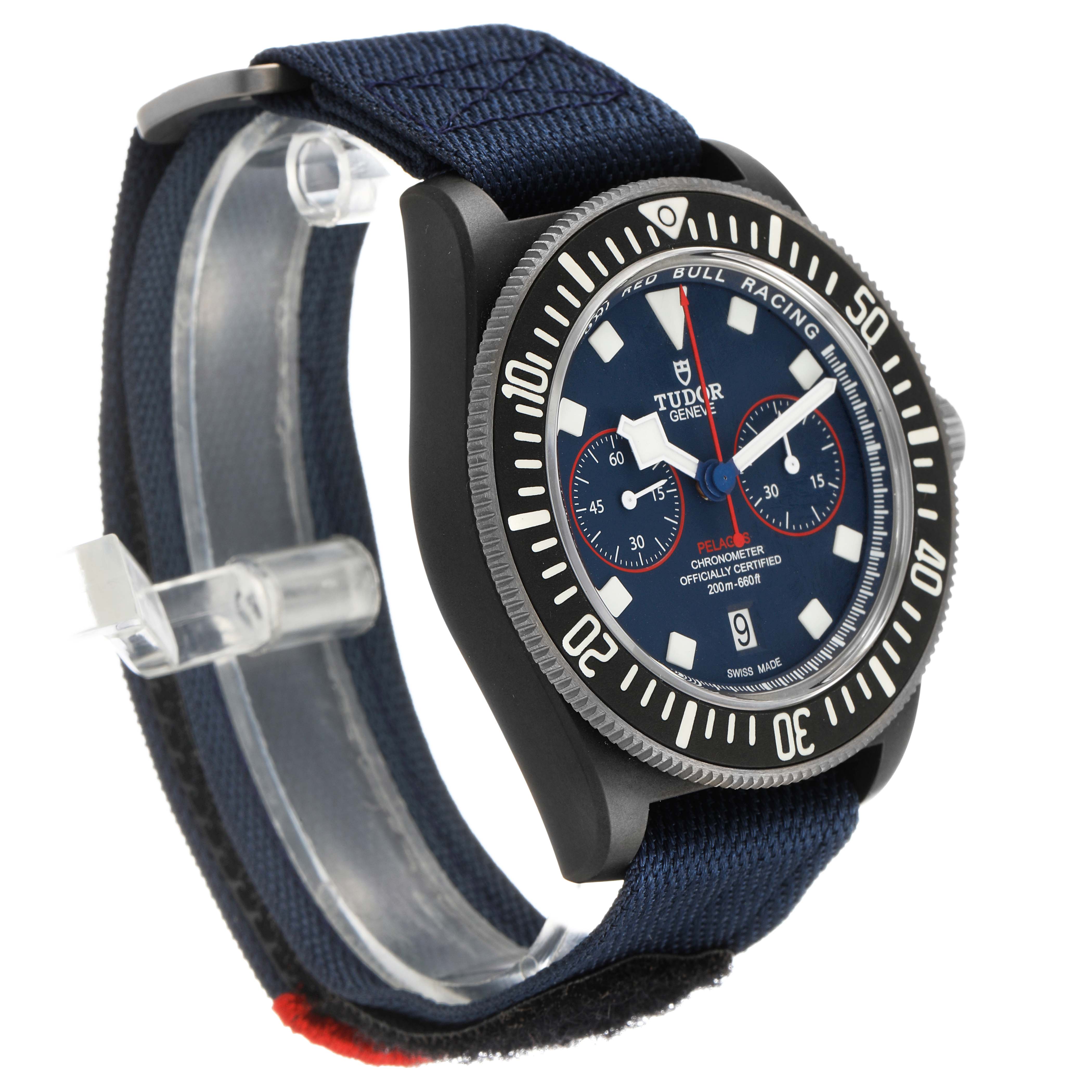 The Tudor Pelagos M25807KN Men's Ceramic Blue Dial watch is displayed at a three-quarter angle, showcasing the face, bezel, and nylon strap.