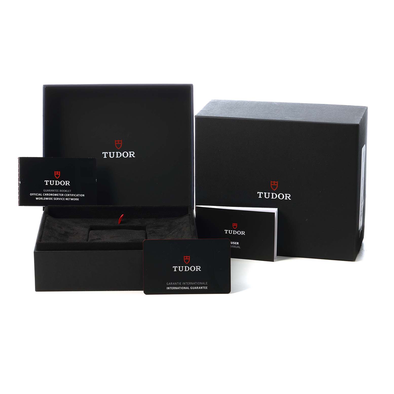 The image shows the Tudor Pelagos M25807KN Men's Ceramic Blue Dial packaging, including a box, guarantee card, and user manual.