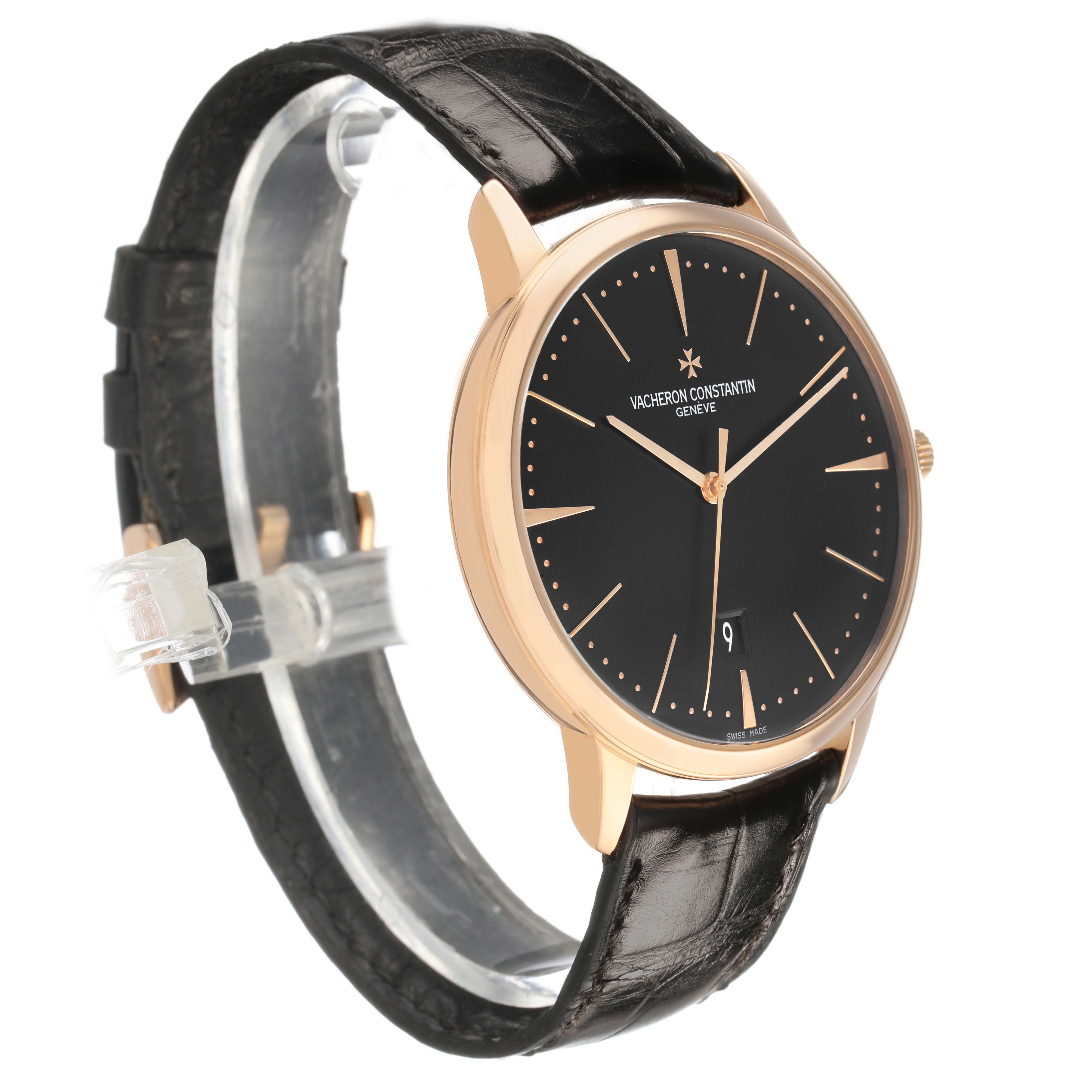 The Vacheron Constantin Patrimony 85180/000R-9232 Men's Rose Gold Black Dial watch is shown at a three-quarter side angle, highlighting the black dial, rose gold case, and leather strap.
