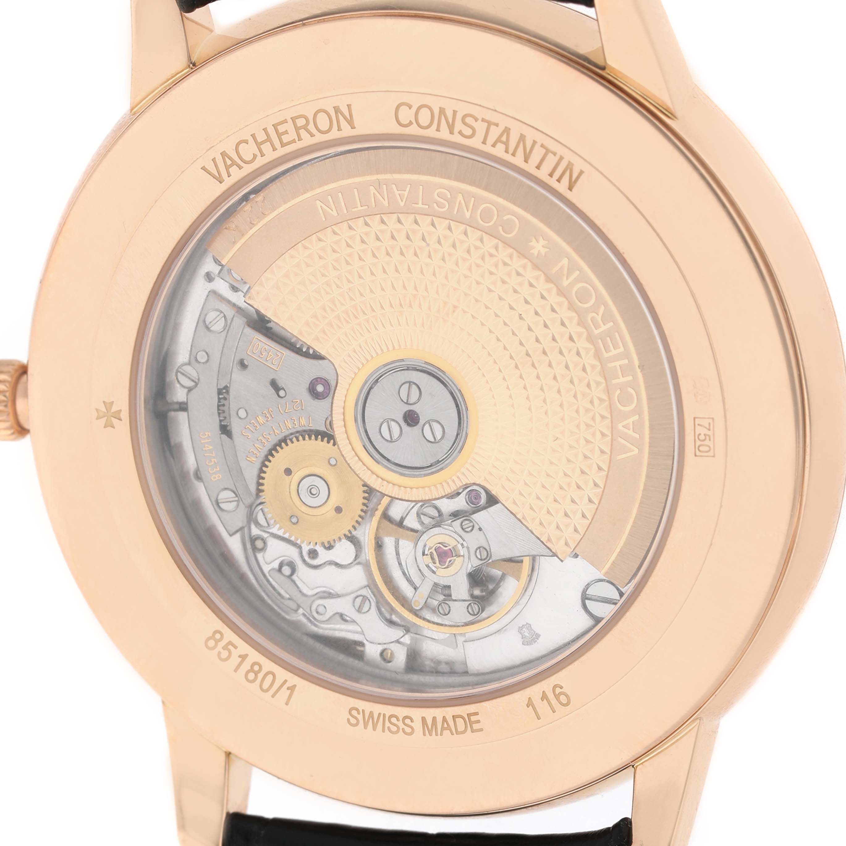 The image shows the back view of a Vacheron Constantin Patrimony 85180/000R-9232 Men's Rose Gold Black Dial watch, highlighting its mechanical movement through a transparent case back.