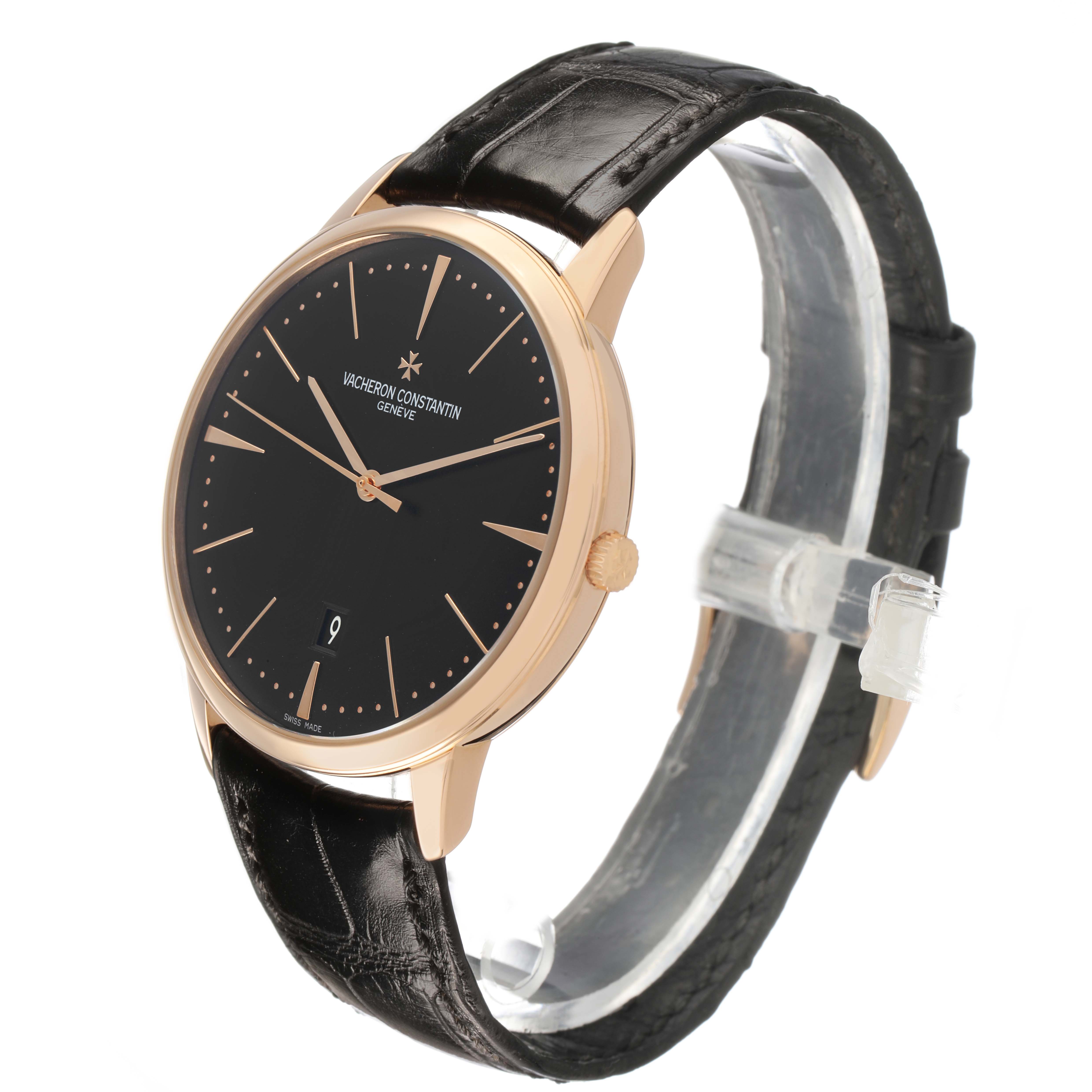 The Vacheron Constantin Patrimony 85180/000R-9232 Men's Rose Gold Black Dial watch is shown at a three-quarter angle, highlighting its black dial, rose gold case, and leather strap.