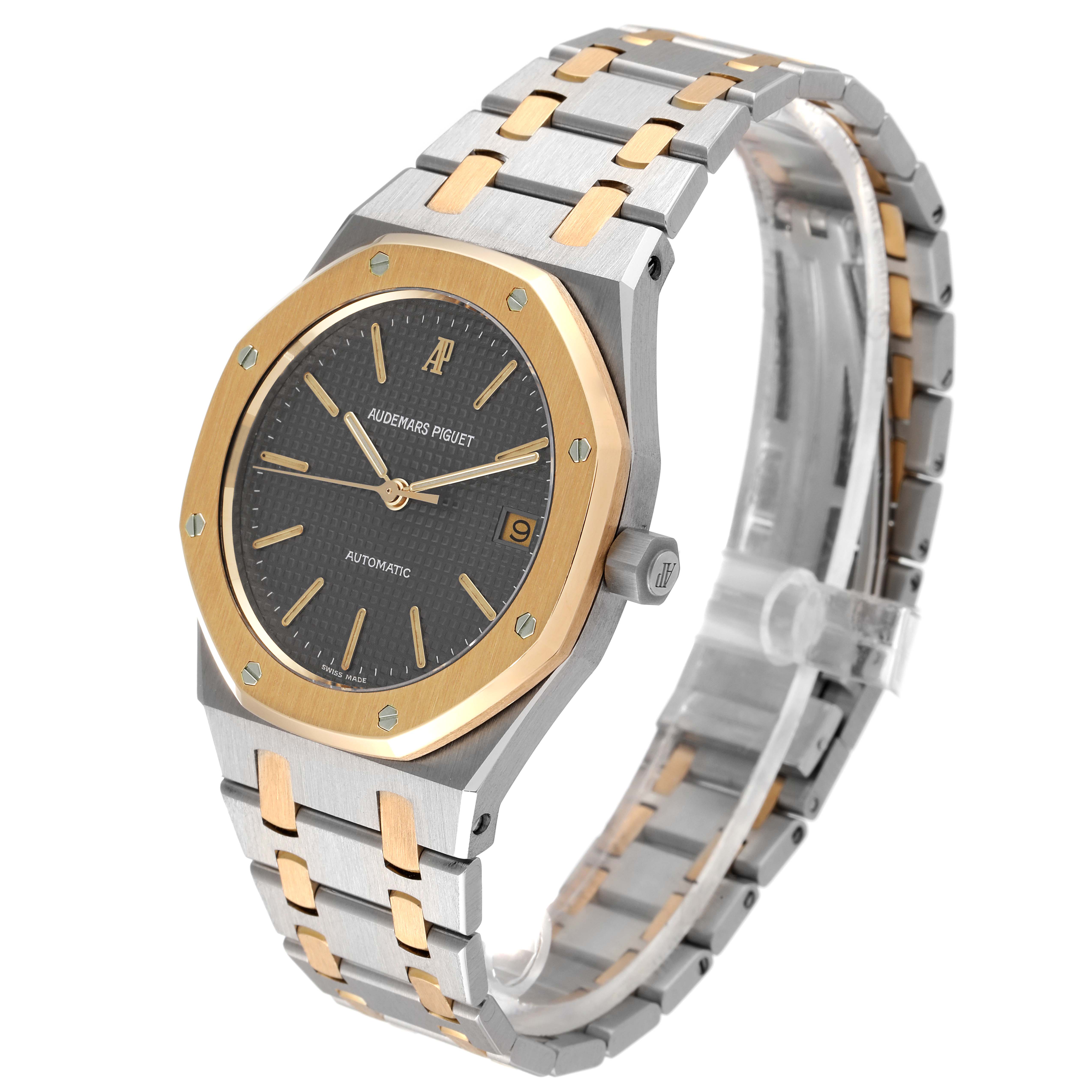 The image shows a side-angle view of the Audemars Piguet Royal Oak 14700SA.00.0789SA.01.B Men's Steel and Gold (two tone) Grey Dial 14700SA.00.0789SA.01.B Men's Steel and Gold (two tone) Grey Dial watch, displaying the face, bezel, crown, and bracelet.