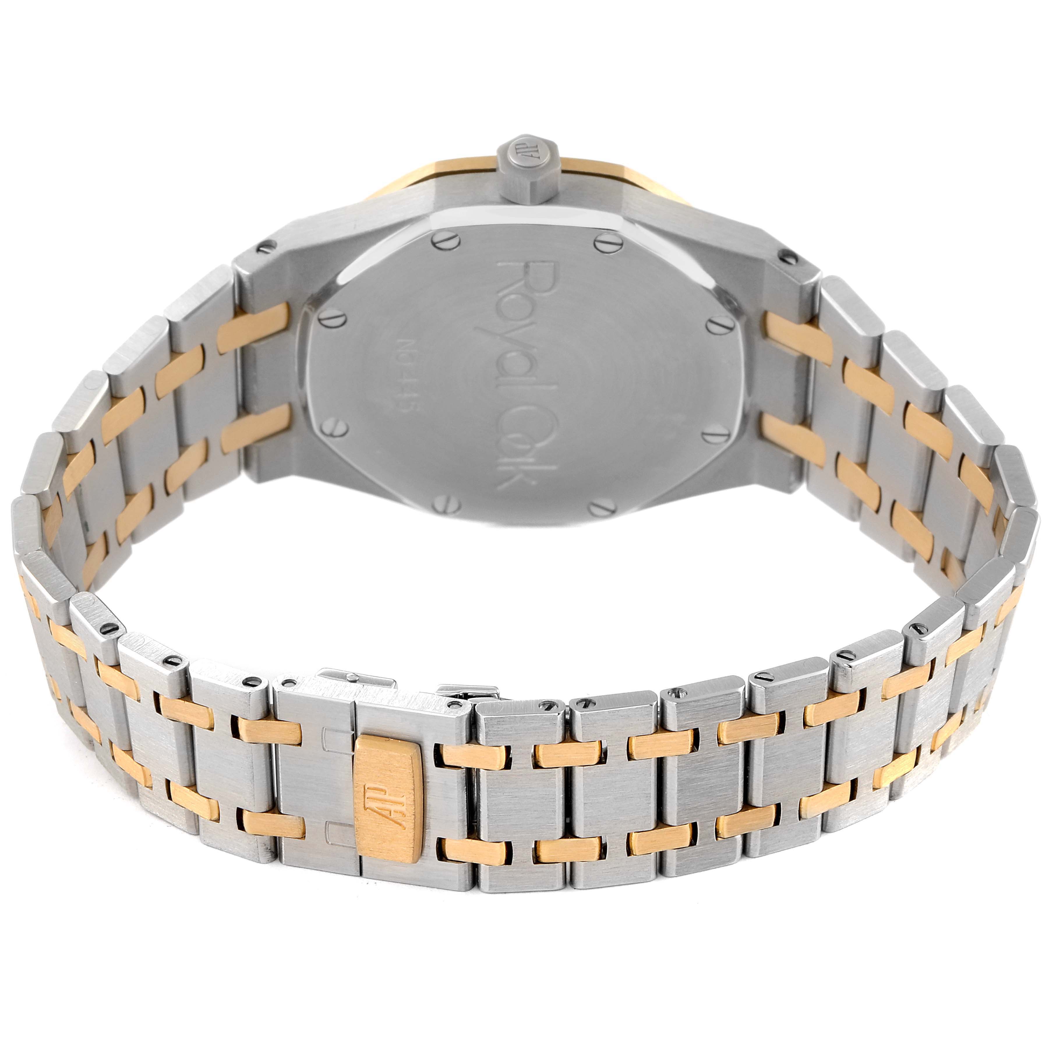 The image shows the back view of a Royal Oak model by Audemars Piguet, focusing on the closed caseback and metal bracelet.