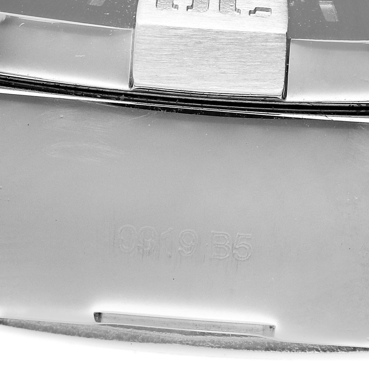 The image shows a close-up of the side of the Breitling Avenger A13371 Men's Stainless Steel Blue Dial A13371 Men's Stainless Steel Blue Dial watch case focusing on the crown or pusher area.