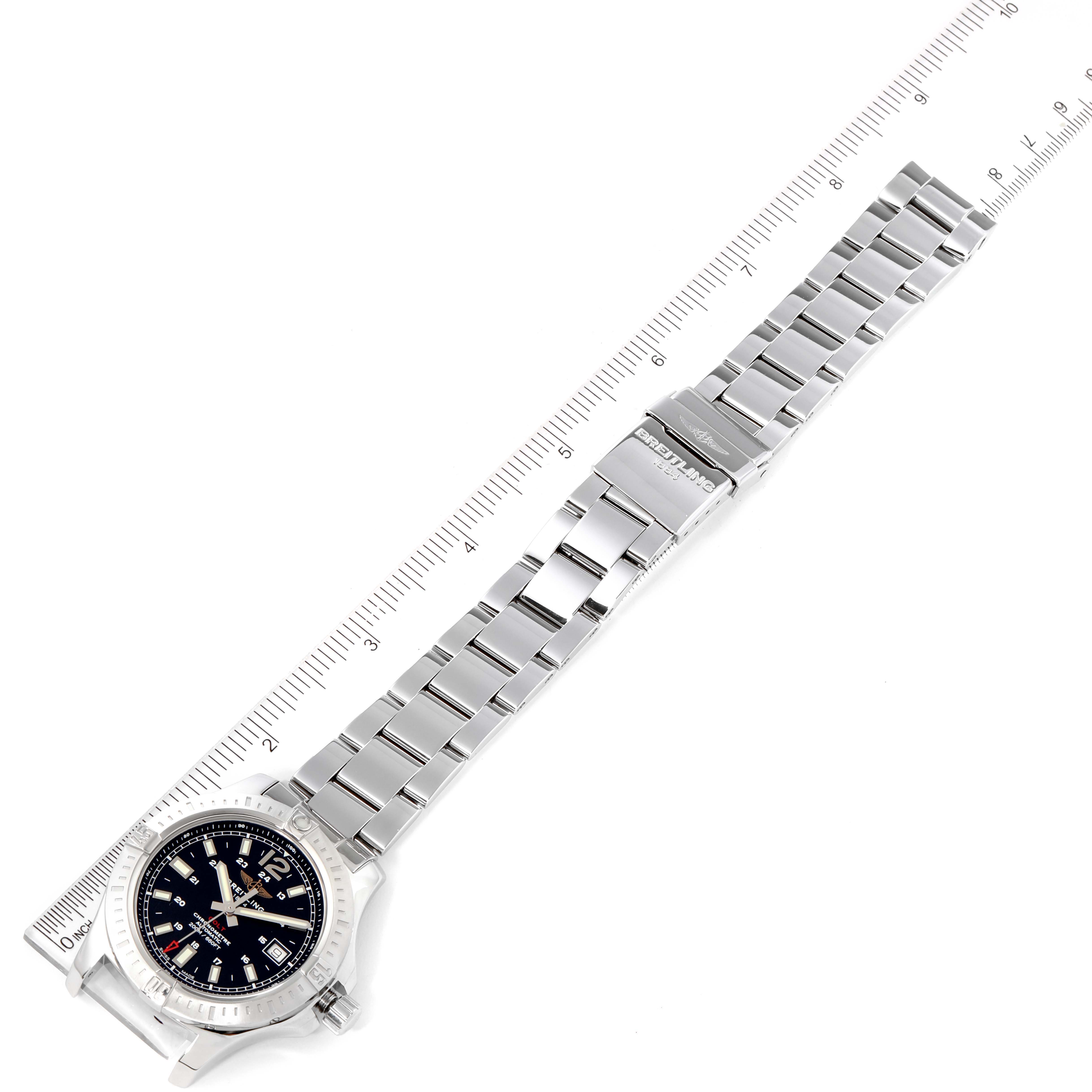 The image shows a Breitling Colt A17313 Men's Stainless Steel Black Dial A17313 Men's Stainless Steel Black Dial watch laid flat, highlighting the face, bezel, and metal link bracelet with a ruler for scale.