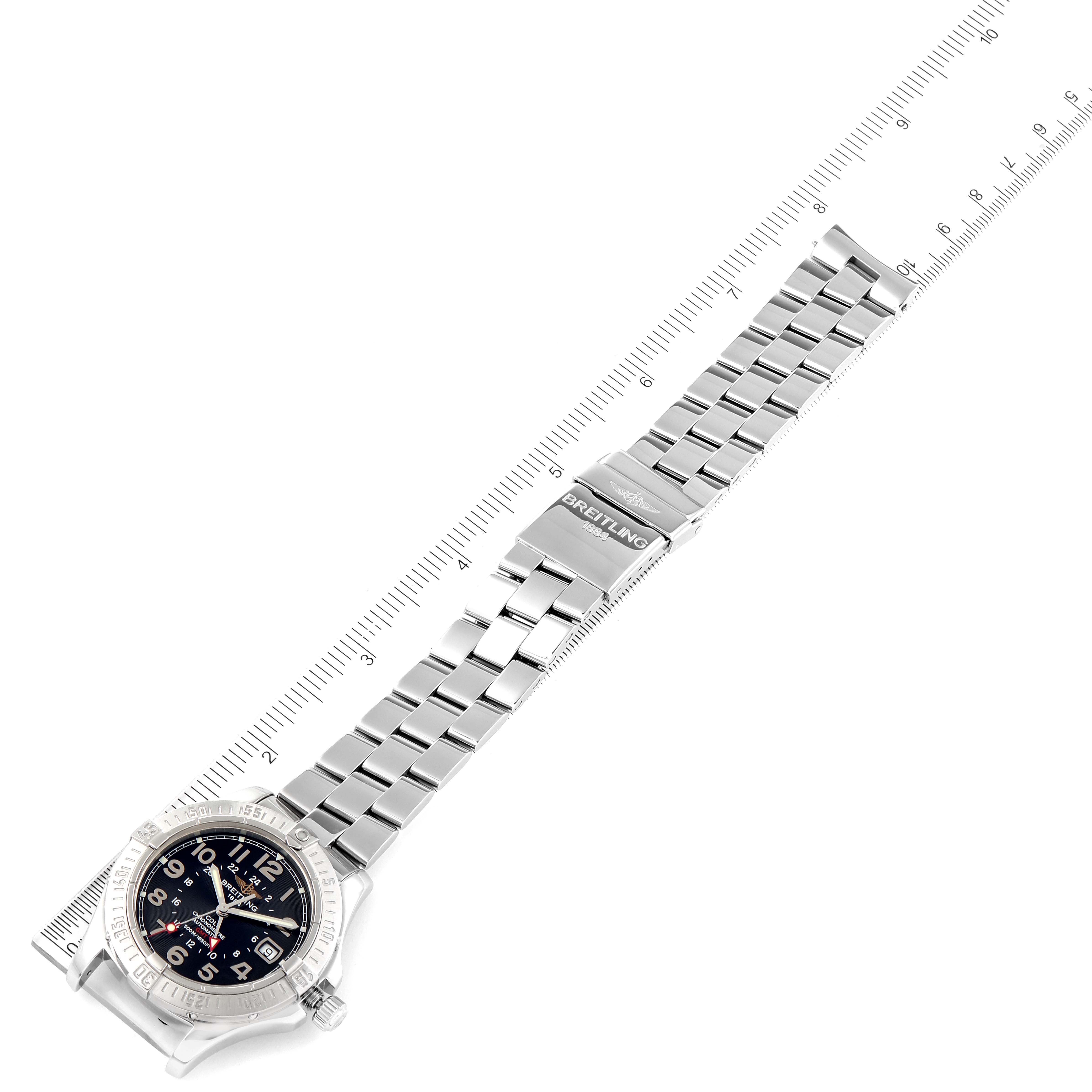 The Breitling Colt A32350 Men's Stainless Steel Black Dial A32350 Men's Stainless Steel Black Dial watch is displayed diagonally, showing its full metal bracelet and clasp, aligned with a ruler for measurement.