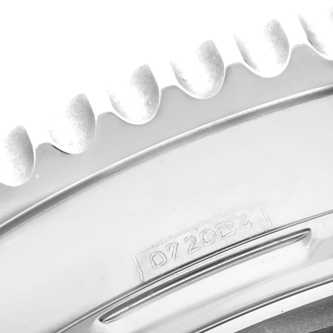 The image shows a close-up of the bezel
s edge and a portion of the caseback with an engraving on a Breitling Navitimer AB0121211B1A1 Men
s Stainless Steel Black Dial AB0121211B1A1 Men
s Stainless Steel Black Dial watch.