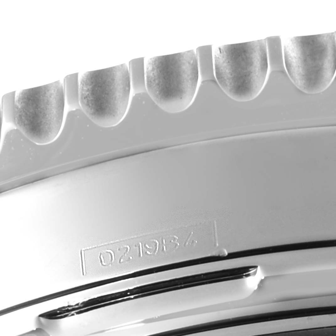 This close-up image shows the edge and part of the bezel of a Breitling Navitimer AB0121 Men
s Stainless Steel Black Dial AB0121 Men
s Stainless Steel Black Dial watch.
