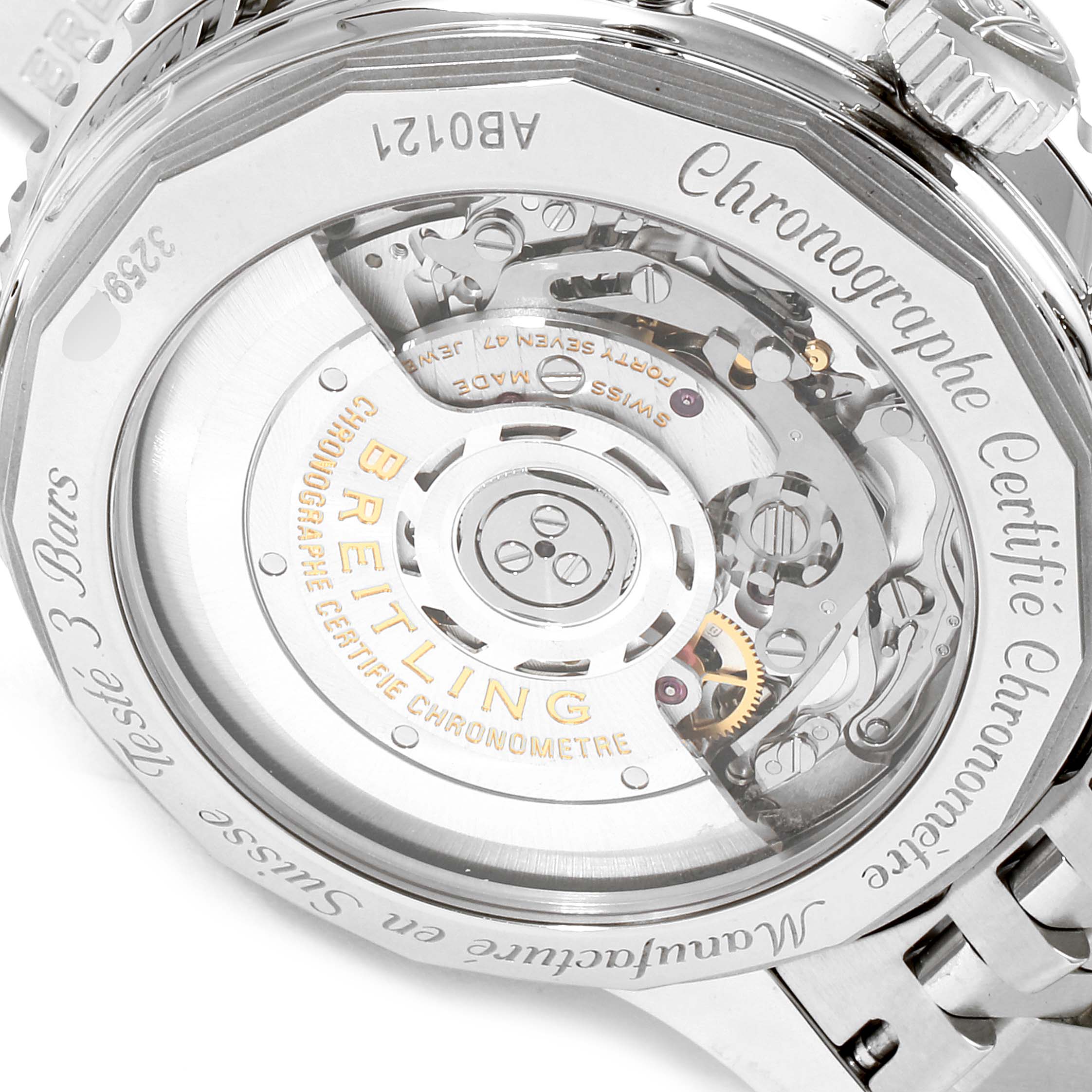 This image shows the back view of a Breitling Navitimer AB0121 Men
s Stainless Steel Black Dial AB0121 Men
s Stainless Steel Black Dial watch, highlighting its intricate mechanical movement and inscriptions.