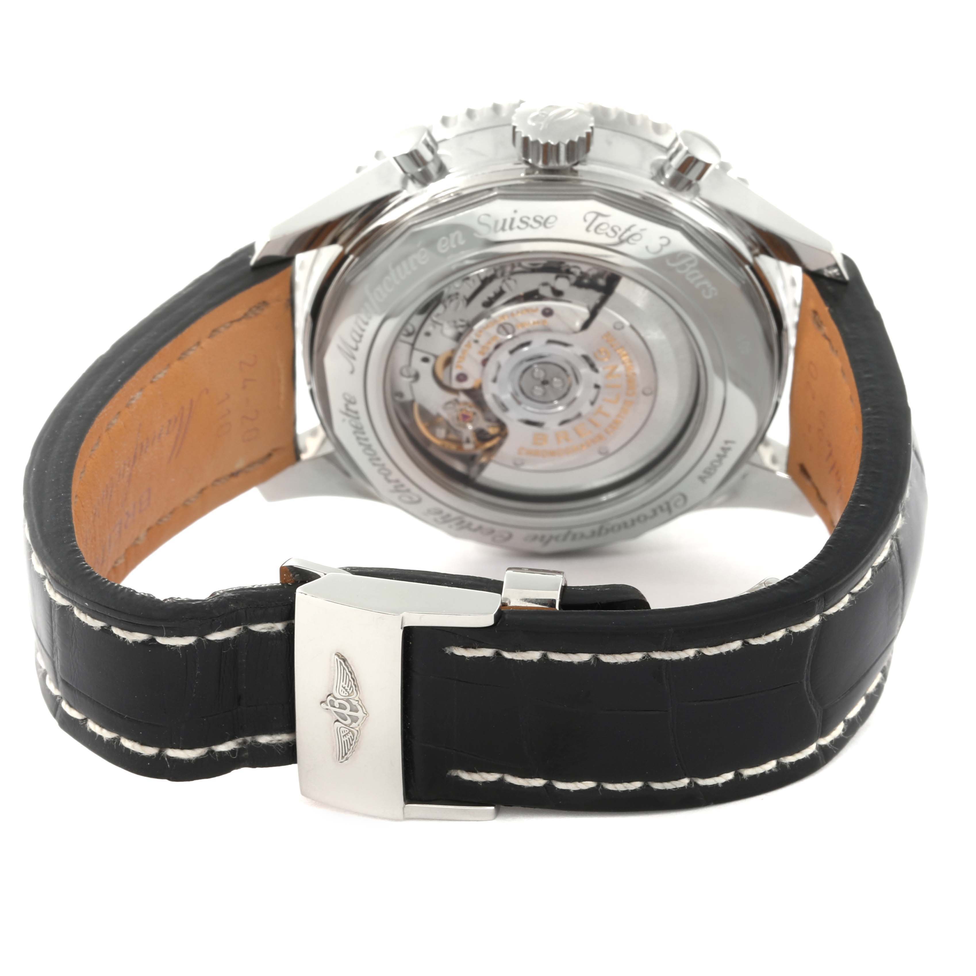 This image shows the back view of a Breitling Navitimer AB0441 Men
s Stainless Steel Black Dial AB0441 Men
s Stainless Steel Black Dial watch, highlighting its movement and leather strap with a clasp.
