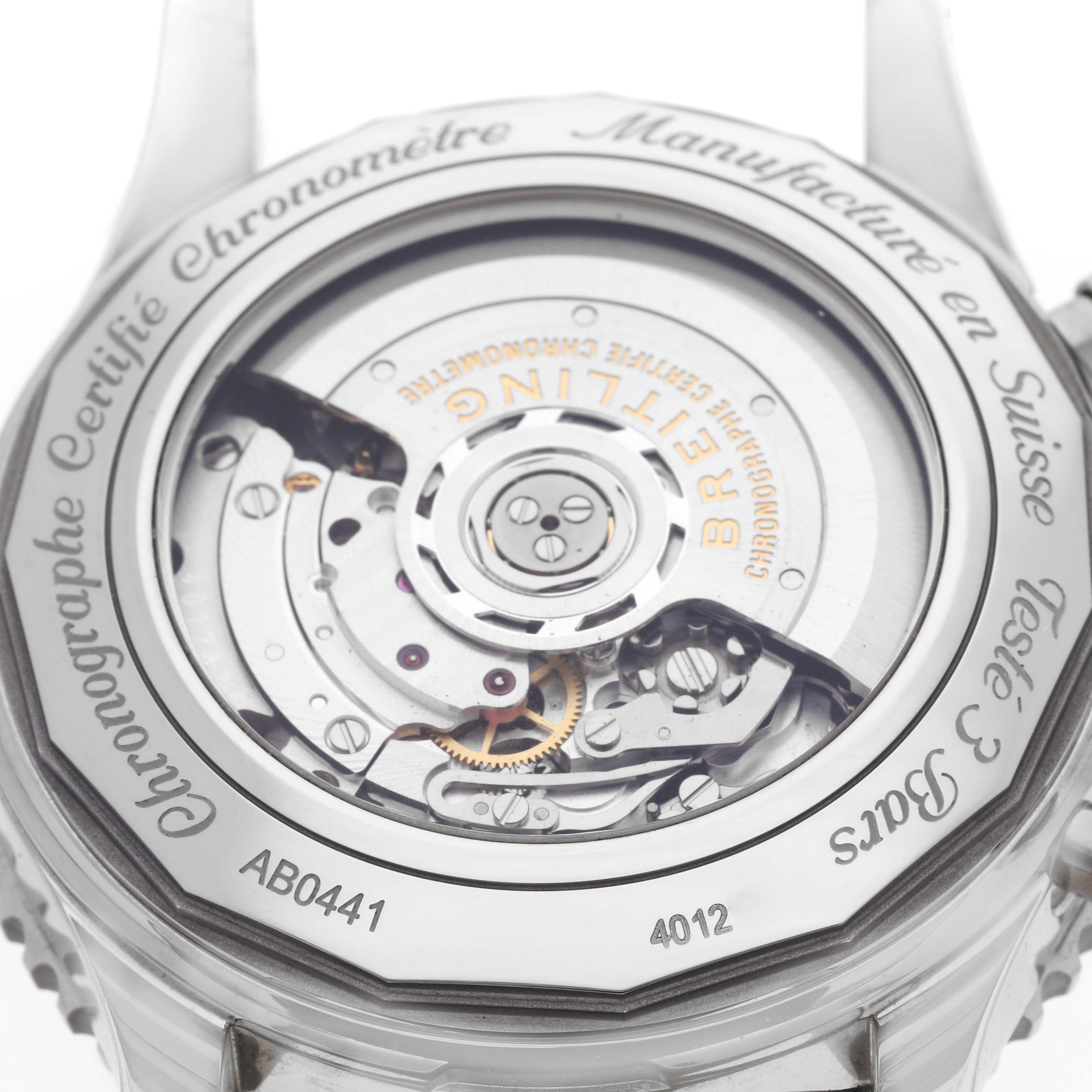 The image shows the backside of a Breitling Navitimer AB0441 Men
s Stainless Steel Black Dial AB0441 Men
s Stainless Steel Black Dial watch, revealing its mechanical movement and inscriptions.