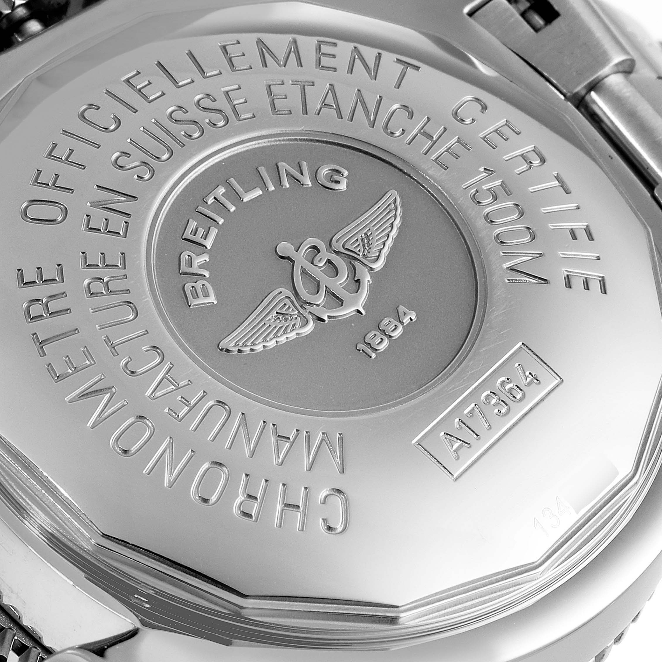 This image shows the back casing of a Breitling Superocean A17364 Men's Stainless Steel Black Dial A17364 Men's Stainless Steel Black Dial watch, featuring engraving details and the brand's emblem.