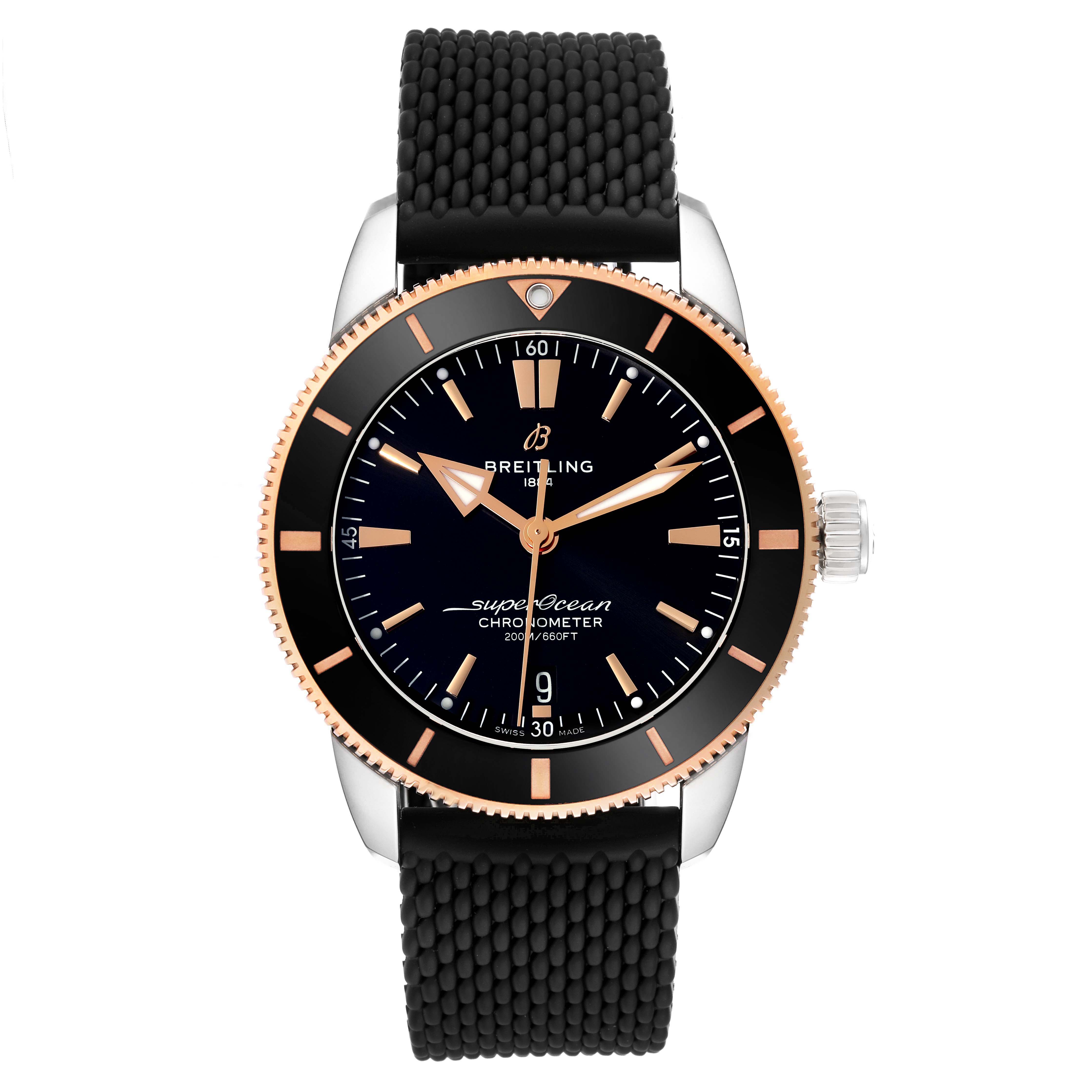The image shows a front view of a Breitling Superocean UB2030121B1S1 Men's Steel and Gold (two tone) Black Dial UB2030121B1S1 Men's Steel and Gold (two tone) Black Dial watch, highlighting its black dial, bezel, and textured black strap.