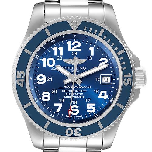 The Breitling Superocean watch is shown from a top view, displaying the blue dial, bezel, and stainless steel bracelet.