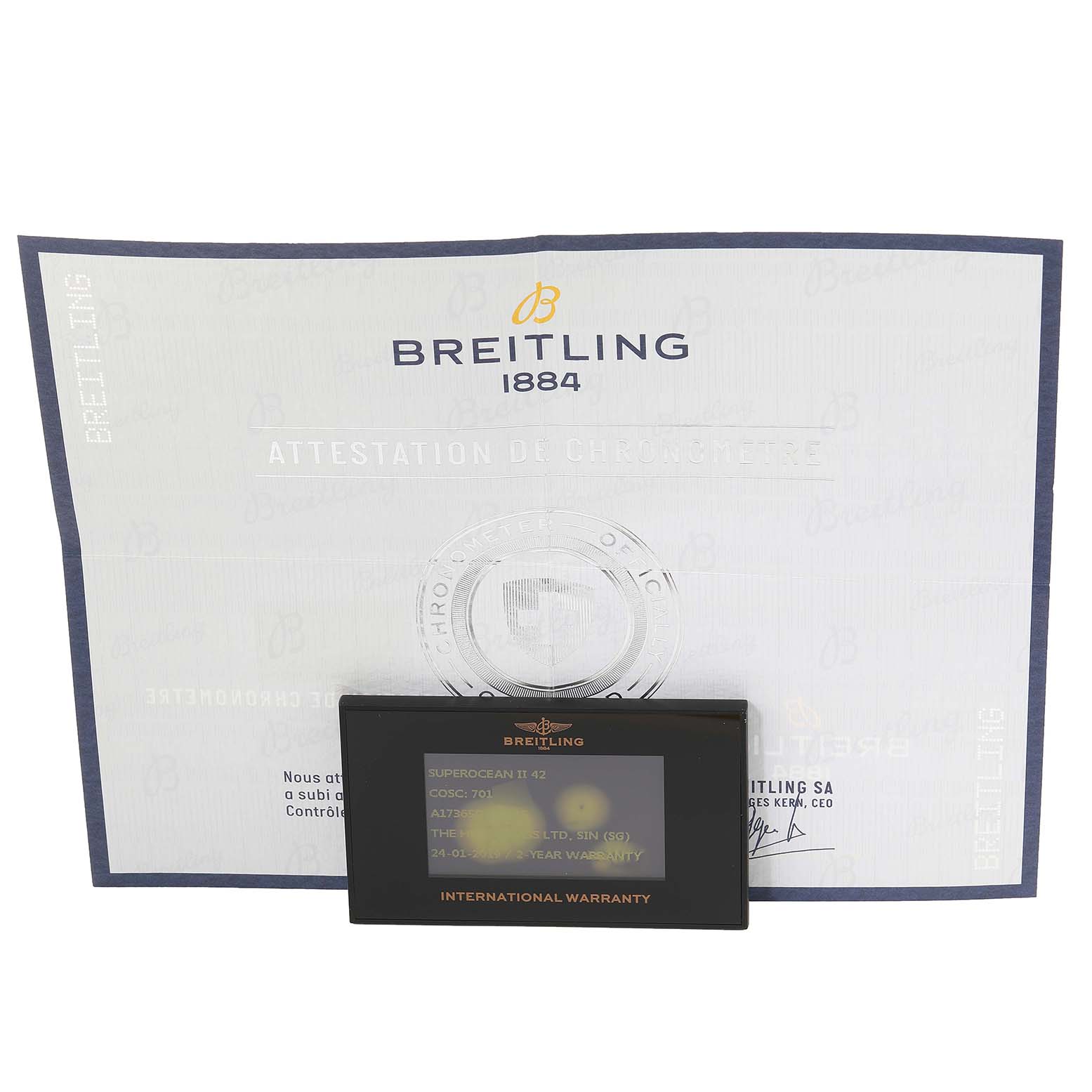 The image shows the international warranty card and chronometer certificate for a Breitling Superocean A17391 Men's Stainless Steel Blue Dial A17391 Men's Stainless Steel Blue Dial watch.